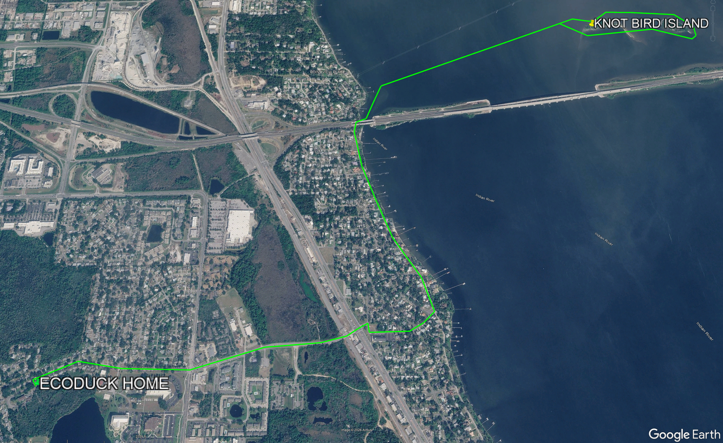 Satellite image of a city near a river showing a marked path to Knot Bird Island and Ecoduck Home along the riverside.