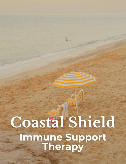 yellow stripe umbrella and chairs on beach, coastal shield