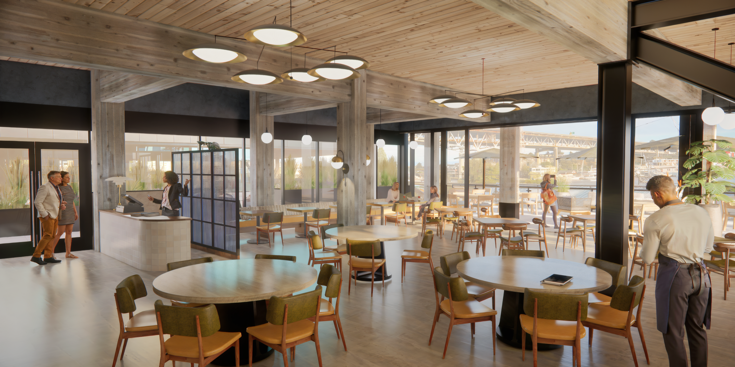 A modern cafe or restaurant with large windows overlooking a marina, with some customers sitting at tables and a few standing and talking near the counter.