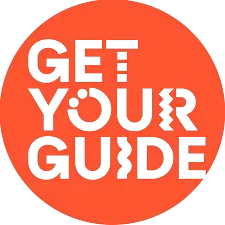 Orange circular button with gray text that reads 'GET YOUR GUIDE'
