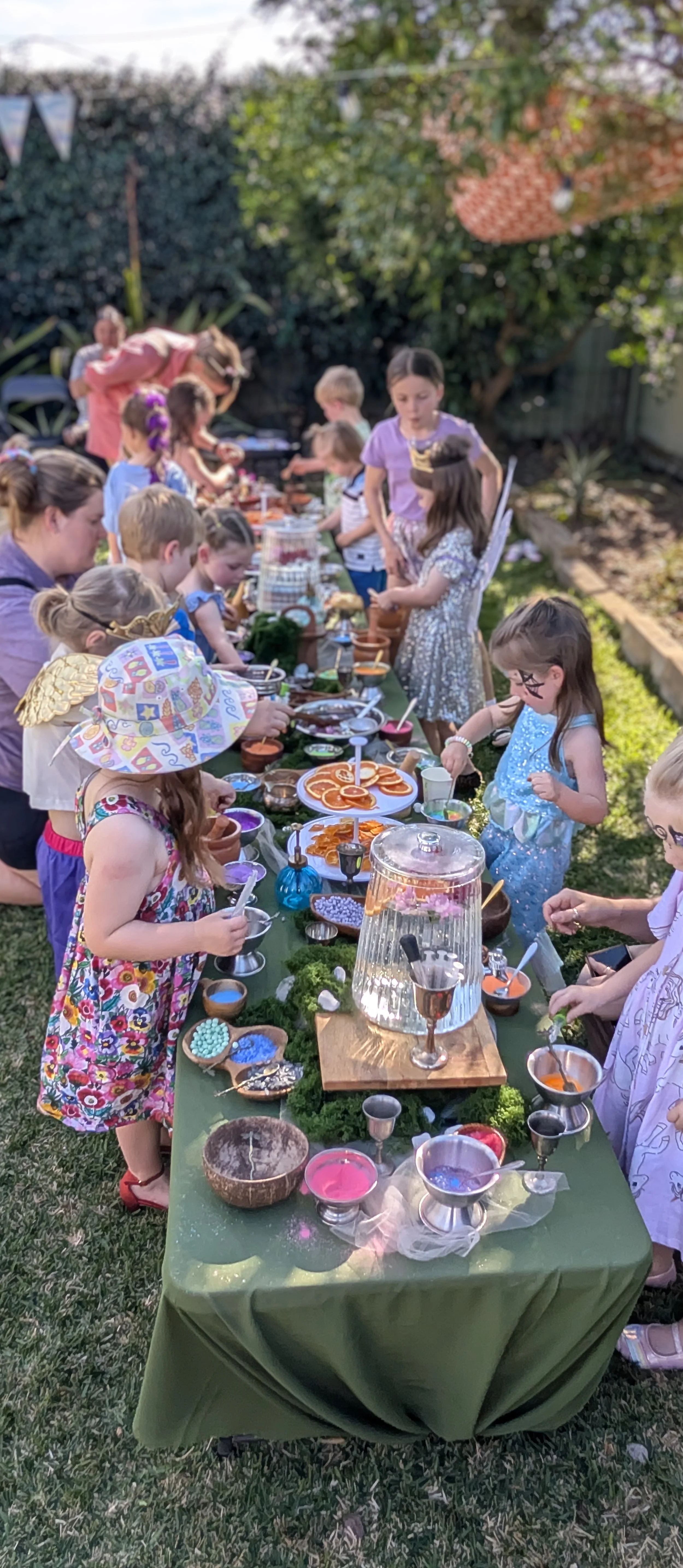 Children's potion party, with beautiful set up decorations and potion powder on a long table.