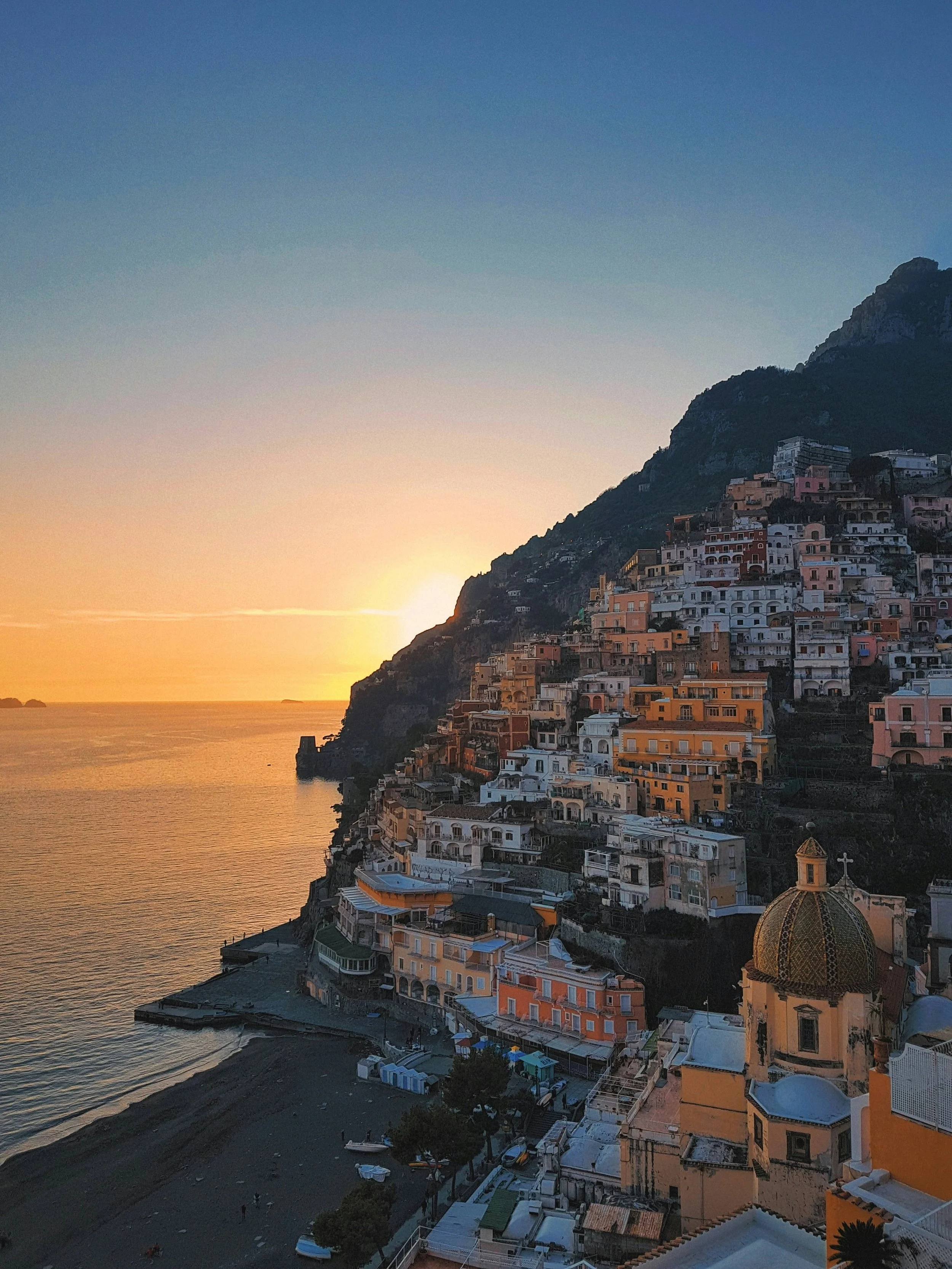 Positano Italy at sunset — Tidal & Rare luxury European travel and bespoke Italian itineraries