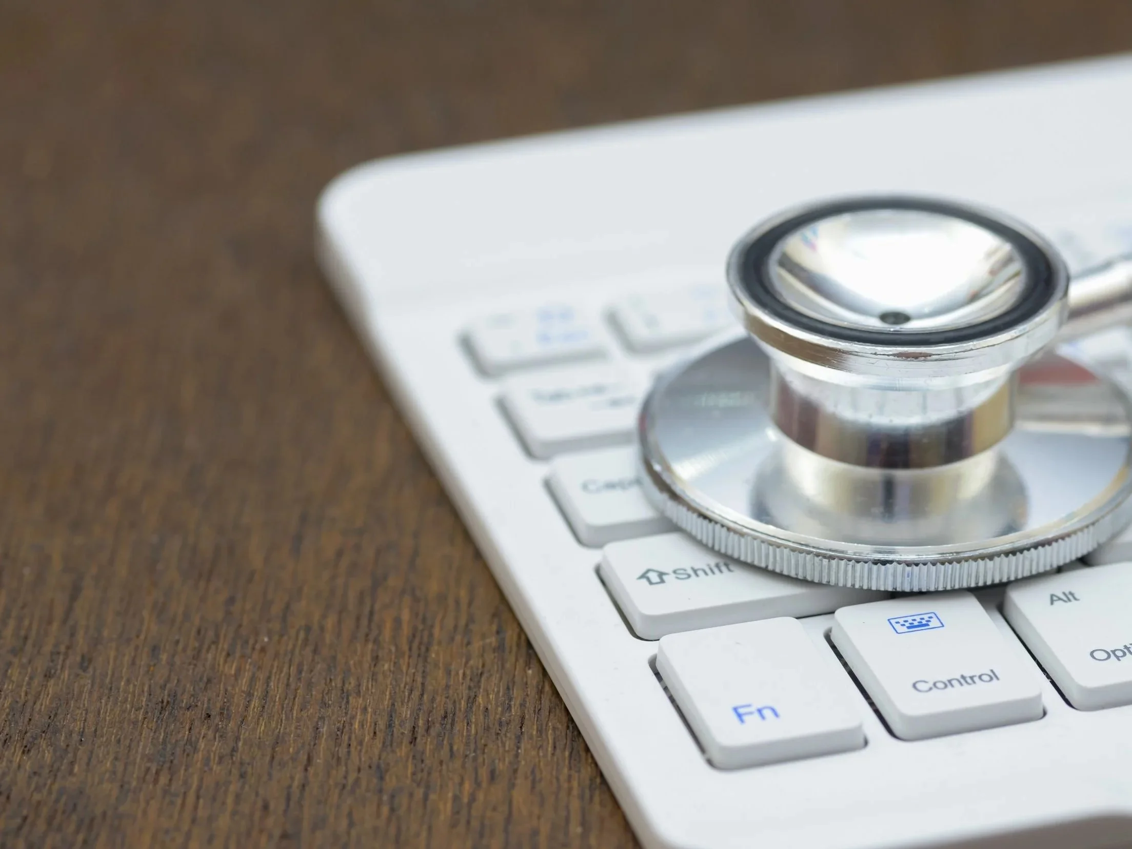 Stethoscope and computer representing telemedicine consultations