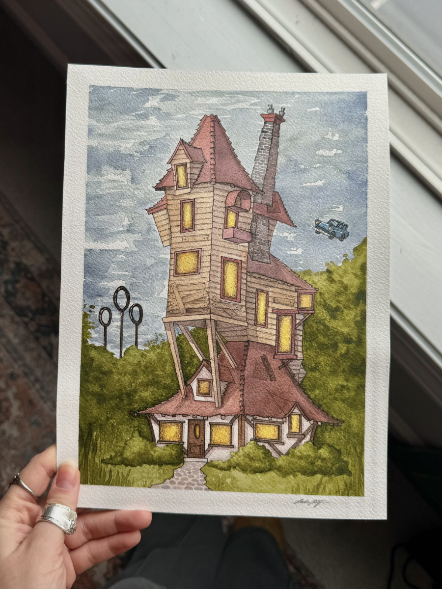 Watercolor painting of a crooked, whimsical house with multiple levels, yellow-lit windows, a chimney, and a red roof, surrounded by green trees and bushes, with a cloudy sky in the background.