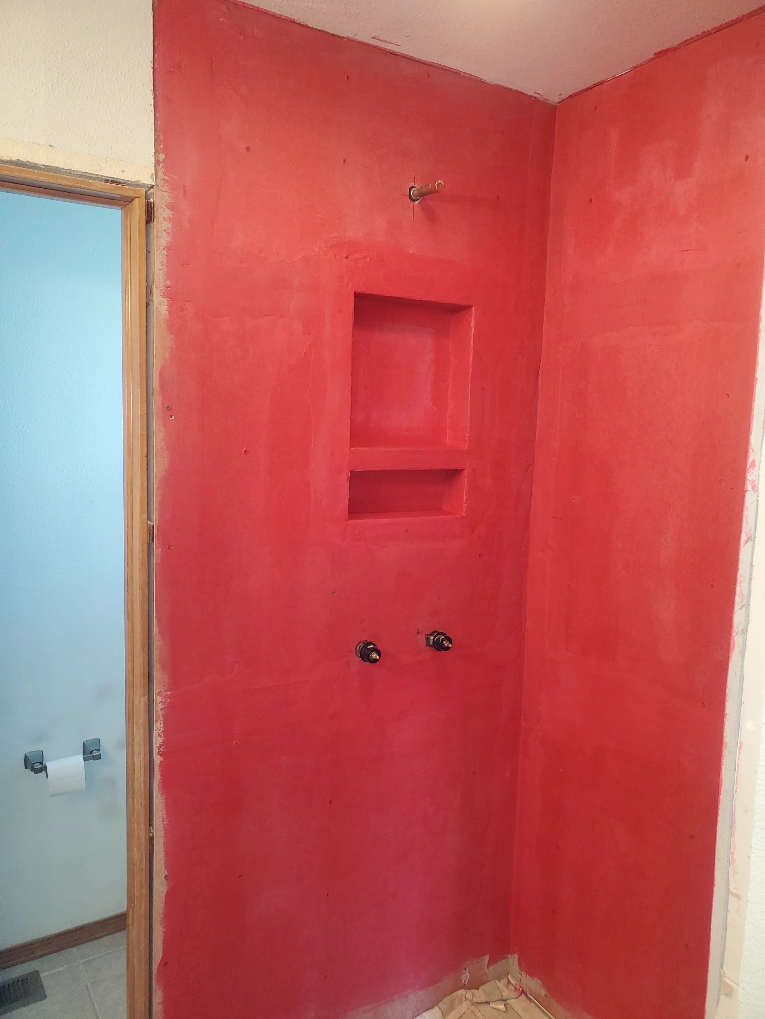 Shower project in progress.  Waterproof redguard membrane applied