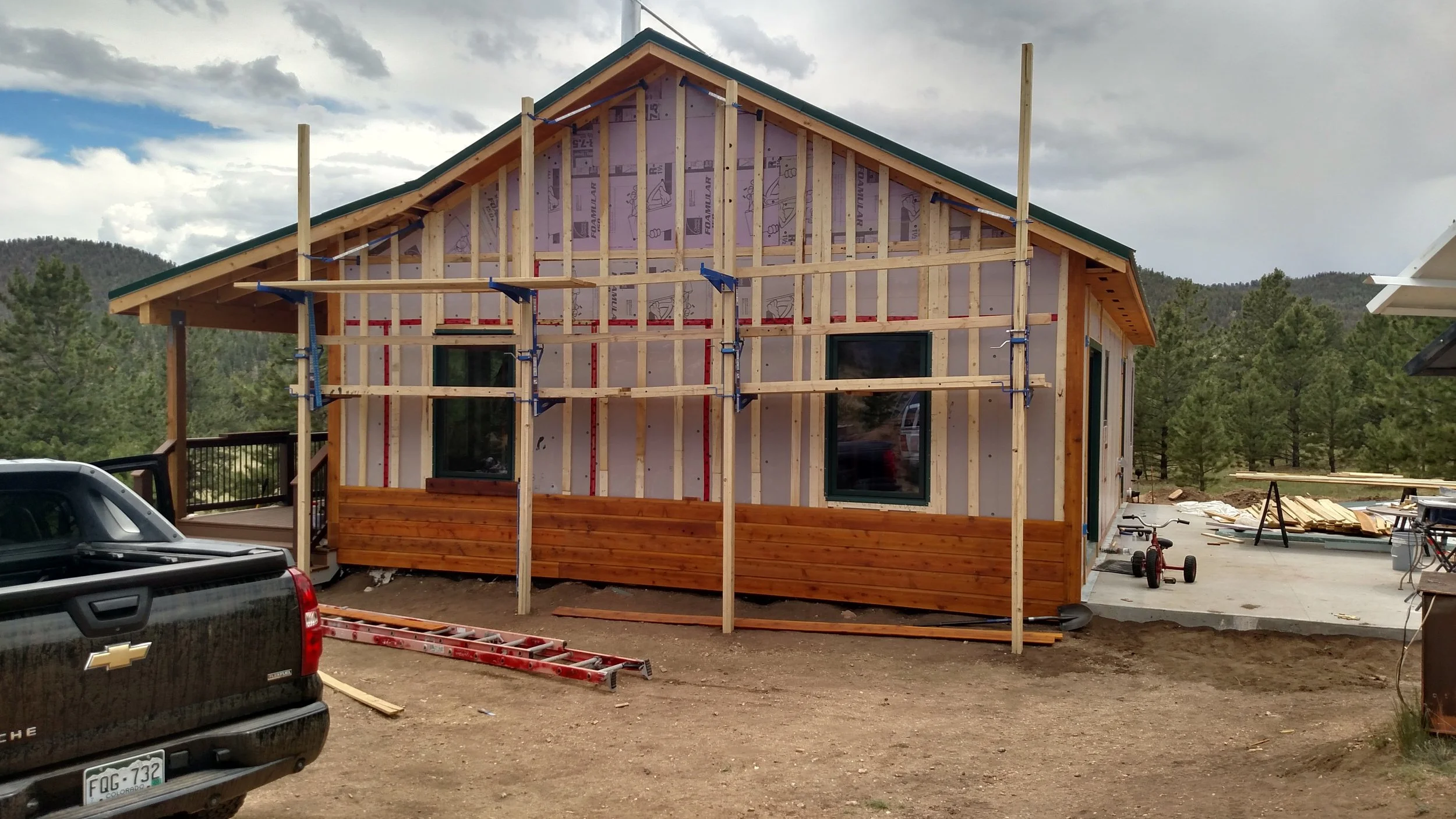 House covered with XPS foam 1-1/2"  adds R-7.5 to the R-23 walls.    total R value is 30+ for wall assembly and all but eliminates thermal bridging