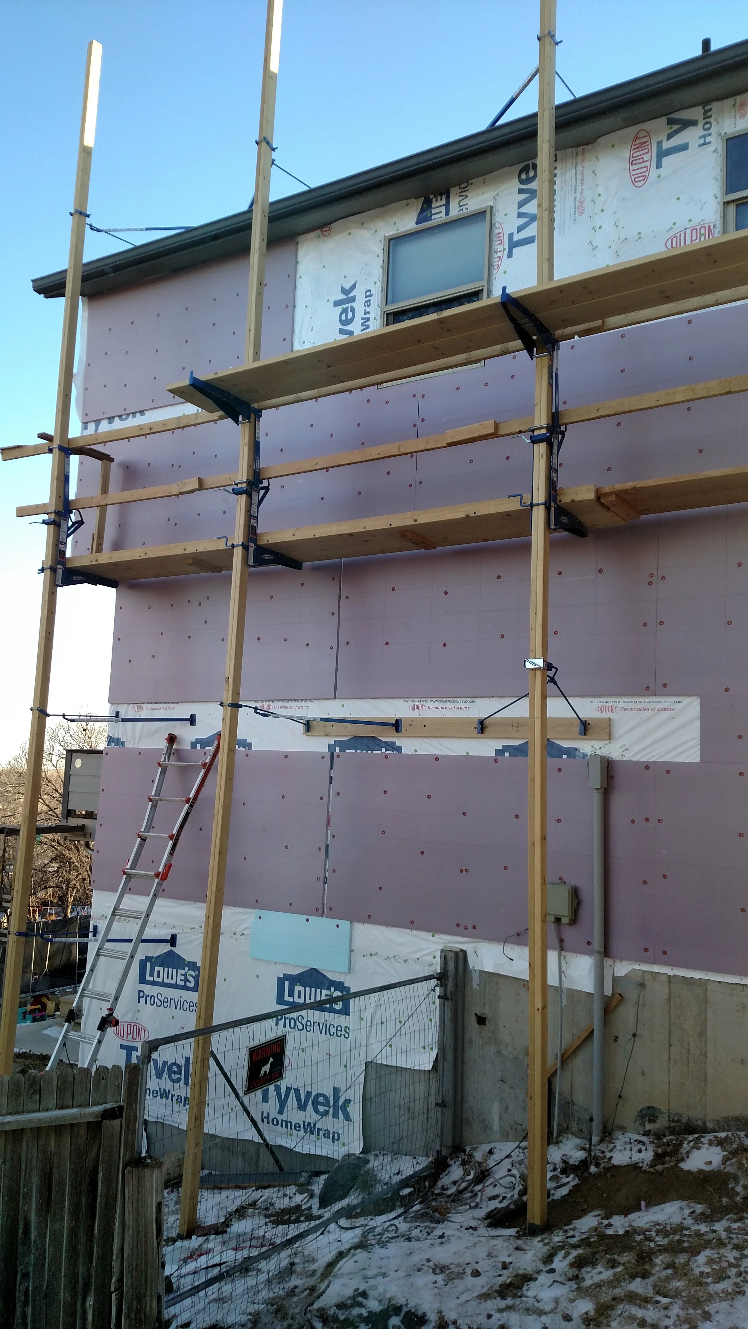 Before Siding adding XPS foam to significantly reduce thermal bridging and increase the home's energy efficiency.
