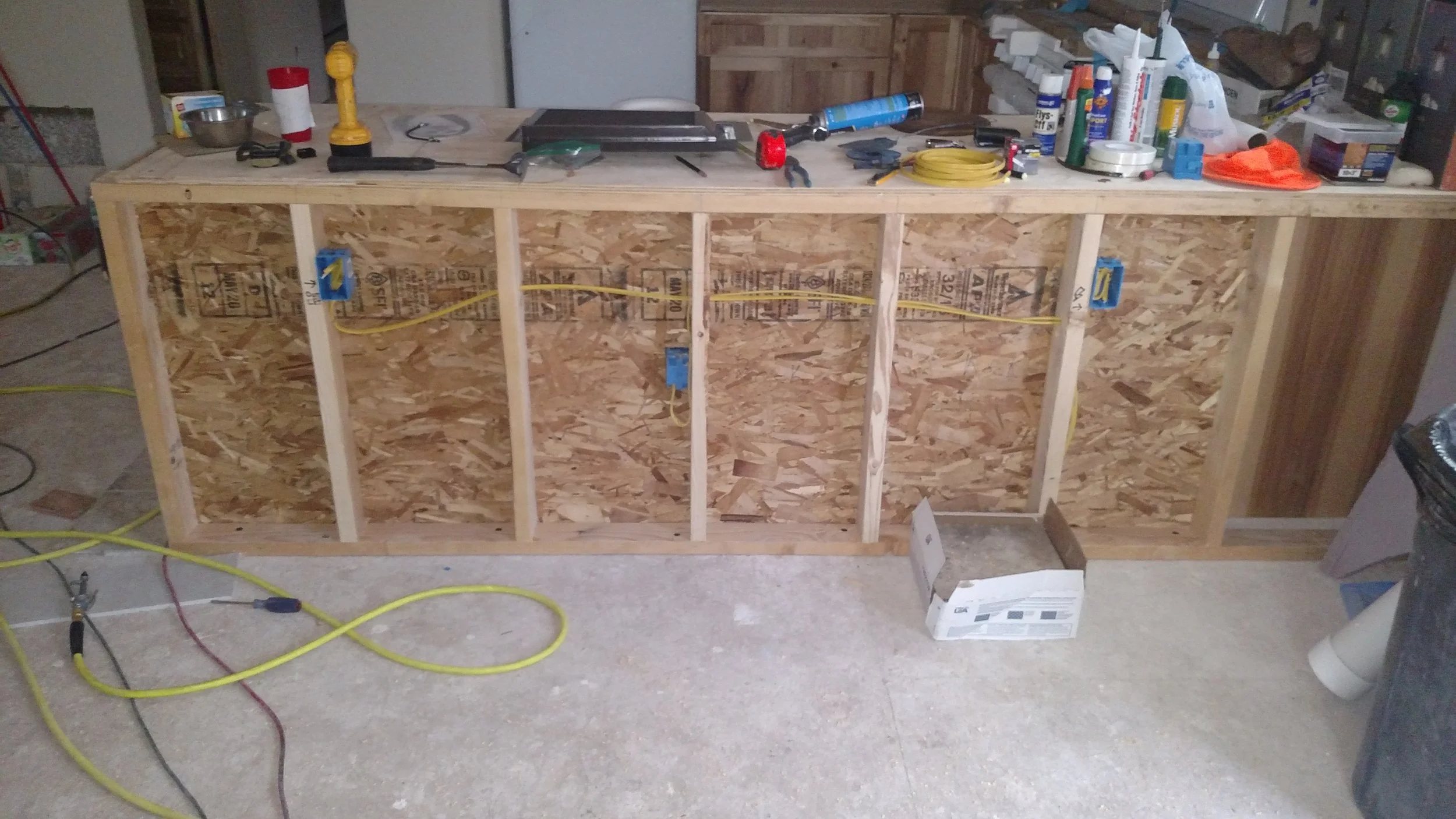 Framed knee wall for kitchen counter.   Sound deadening insulation added later to keep the dishwasher ultra quiet