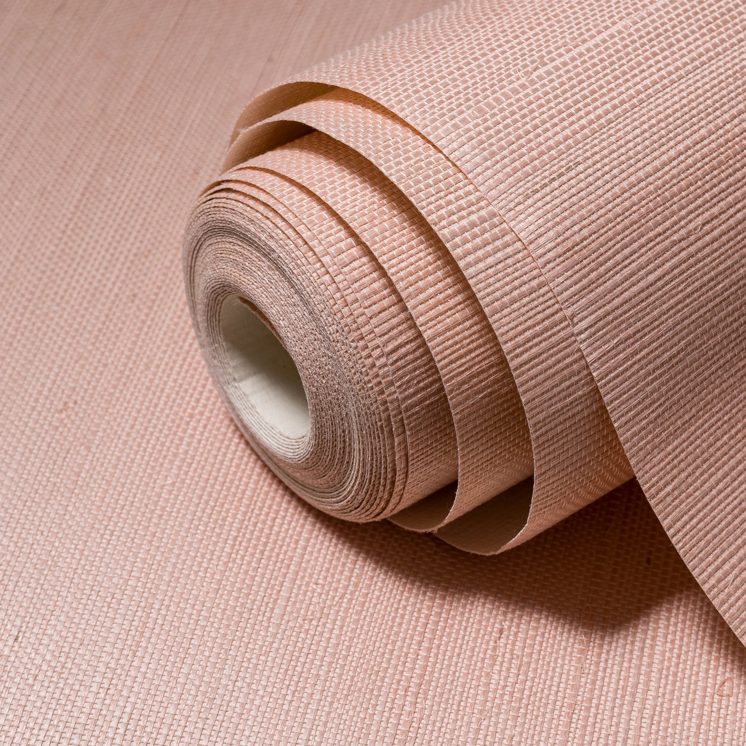 A softer way to bring colour into a space.

Blossom pairs a muted pink tone with the organic character of natural sisal, creating a wallcovering that feels warm, calm, and quietly refined.

The woven texture gives the colour movement and depth, allow