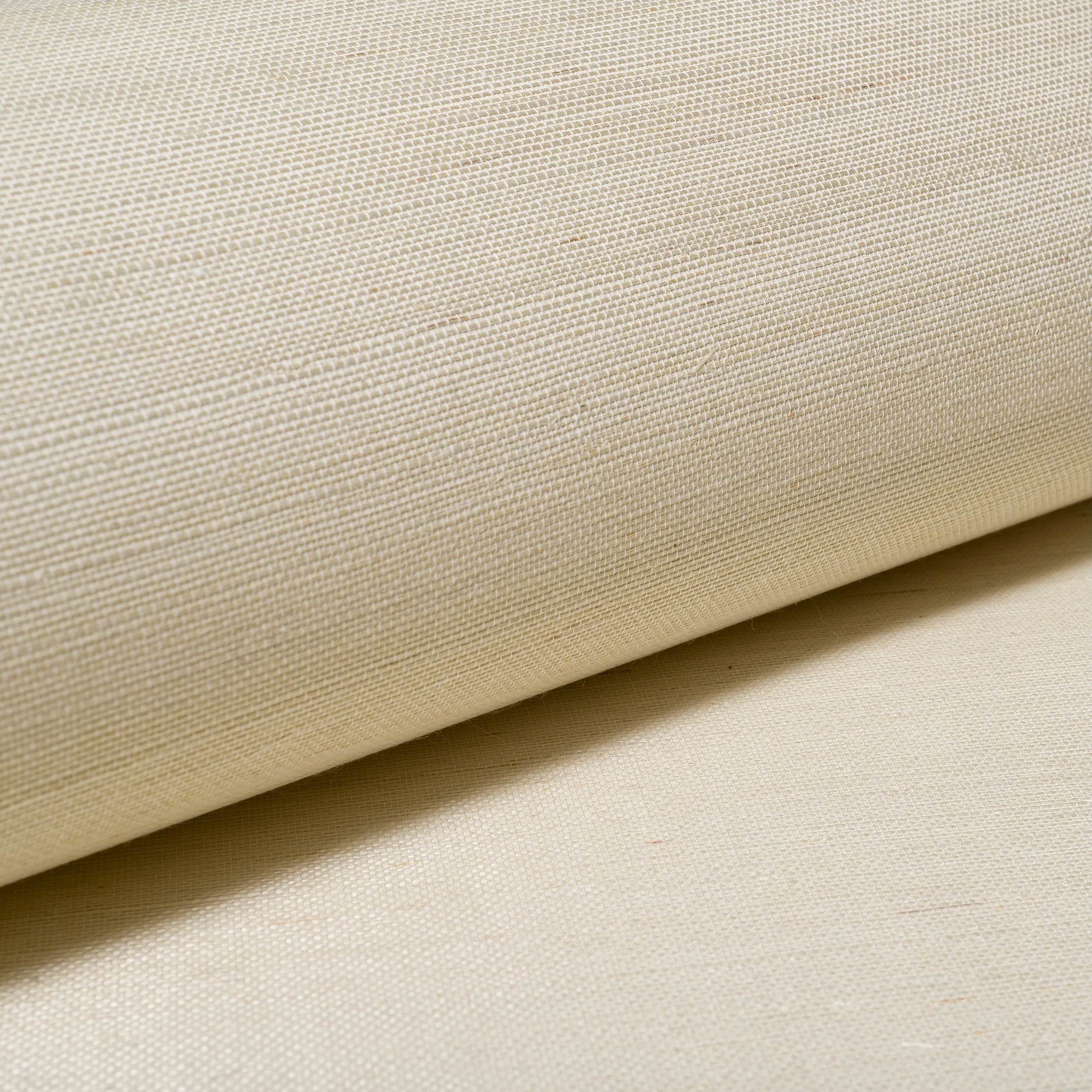 Texture that softens a space.

The weave reveals delicate shifts in fibre and tone, giving the surface a quiet sense of movement and warmth.

Crafted from natural materials, these subtle variations allow the wallpaper to feel layered, lived in, and d