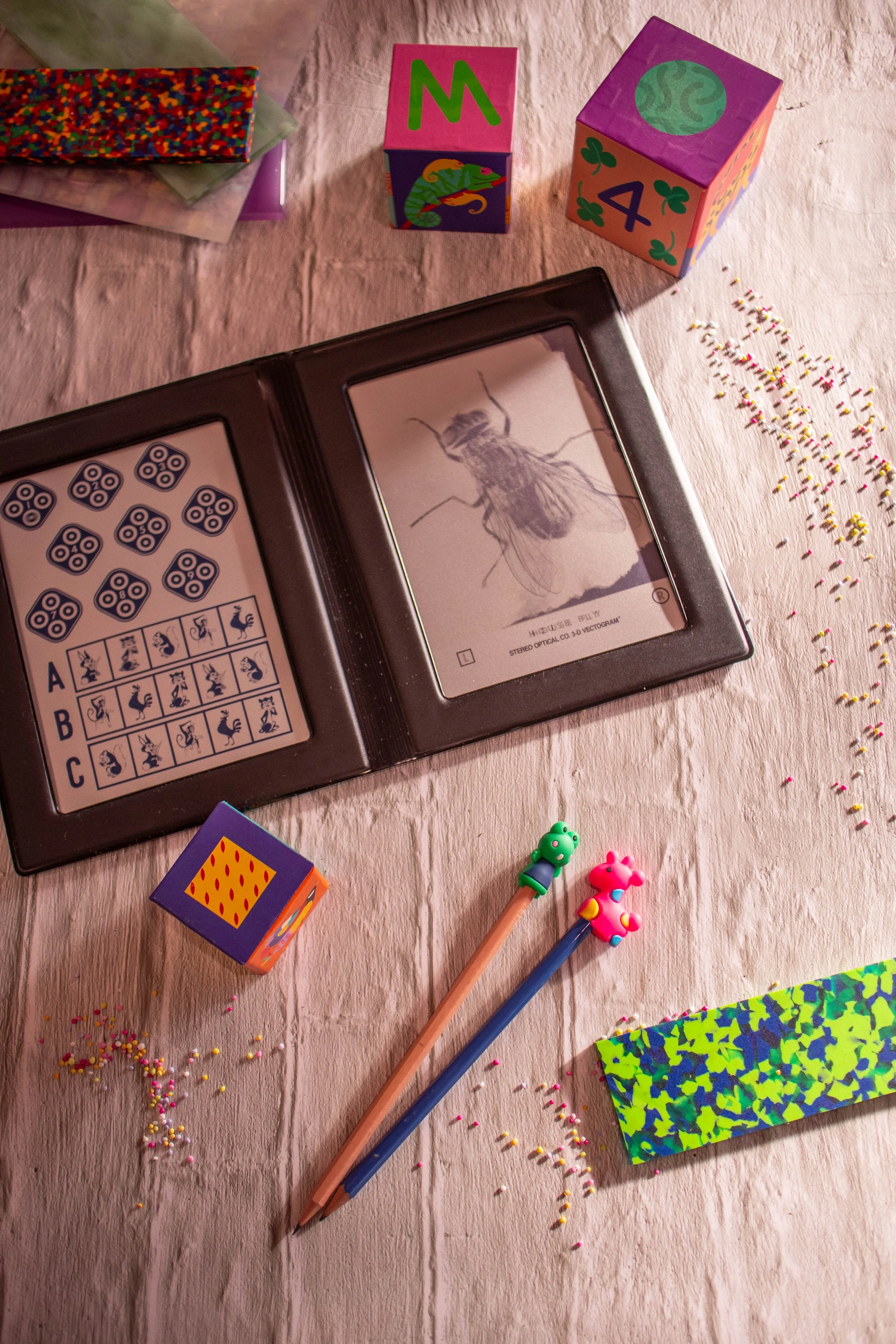 Eye examinations for children, colourful tests, playing blocks, pencils, and sprinkles