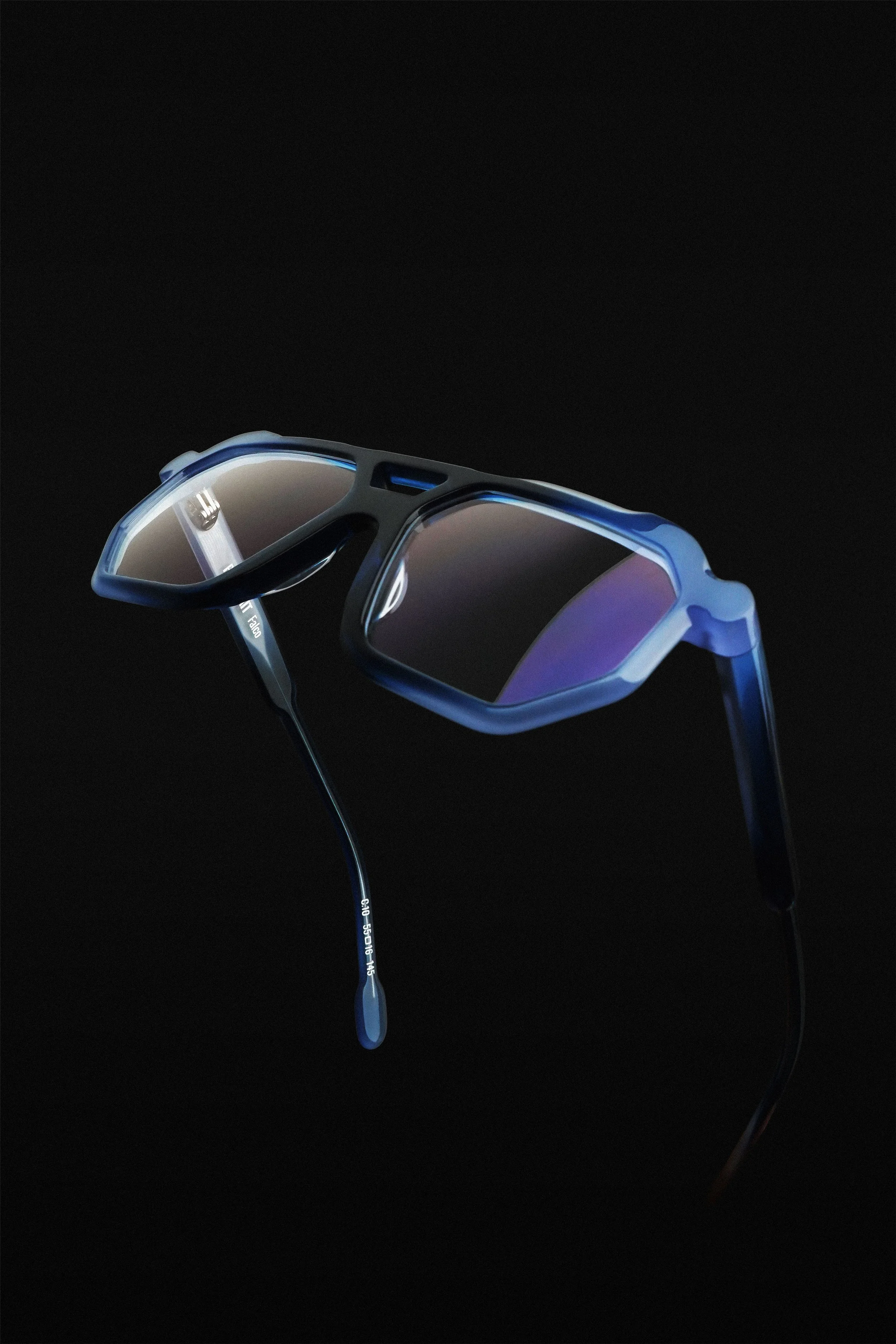 A pair of sports sunglasses with a sleek, wraparound design, set against a black background.