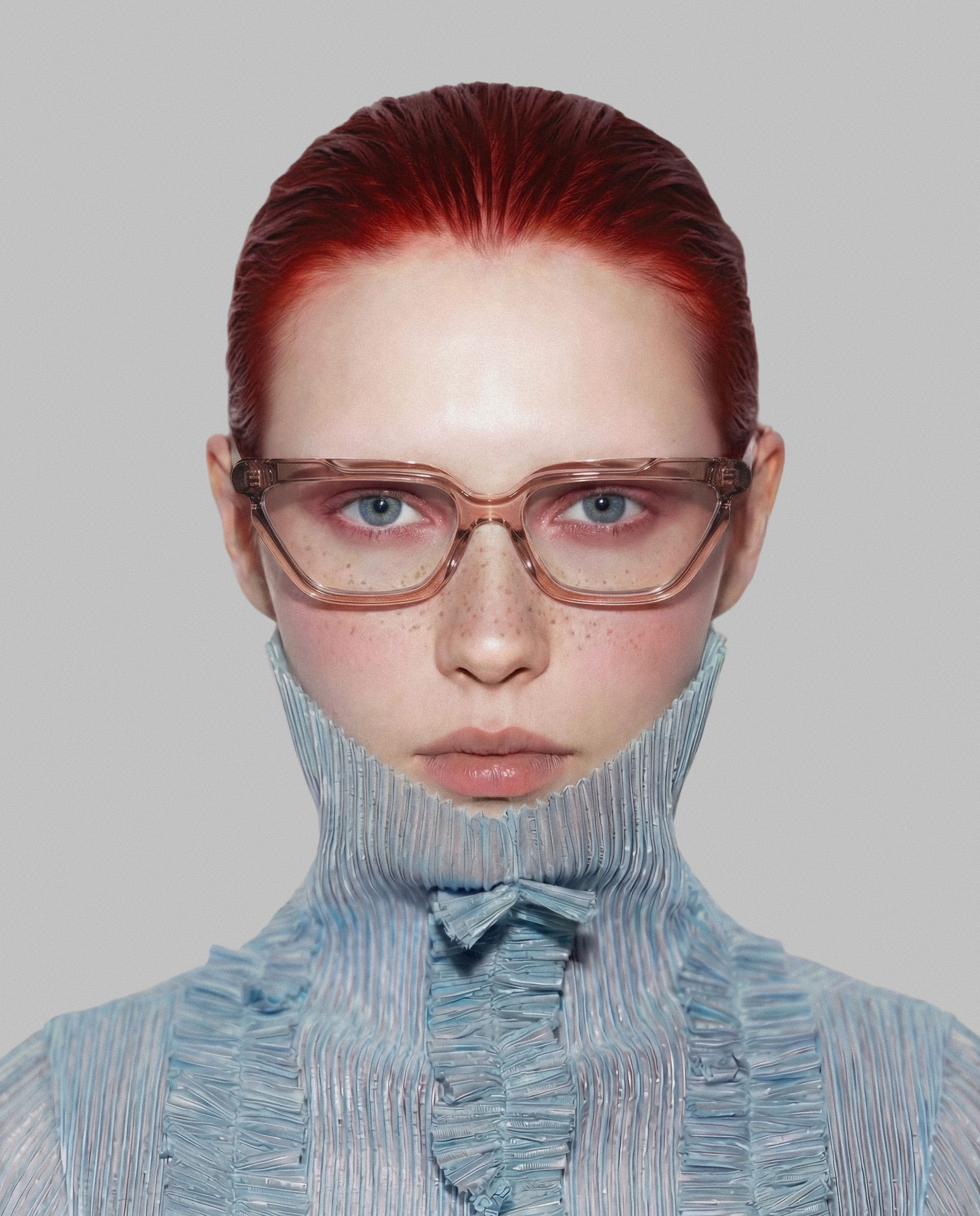 Close-up of a person with bright red hair, wearing pink-tinted glasses and a striped blue uniform with a textured pattern.