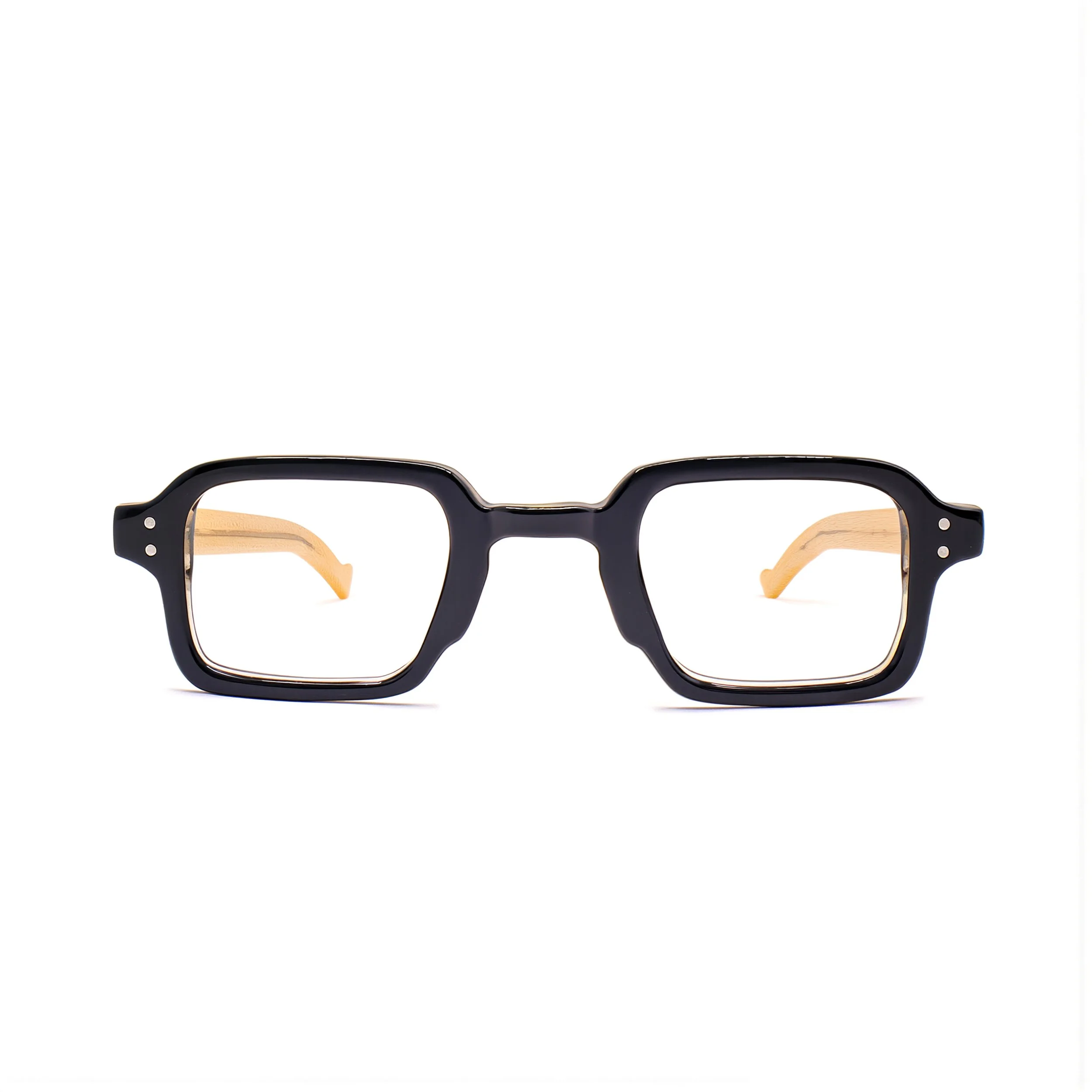 Part of a pair of eyeglasses with black and tortoiseshell frames, only the top half visible against a white background.