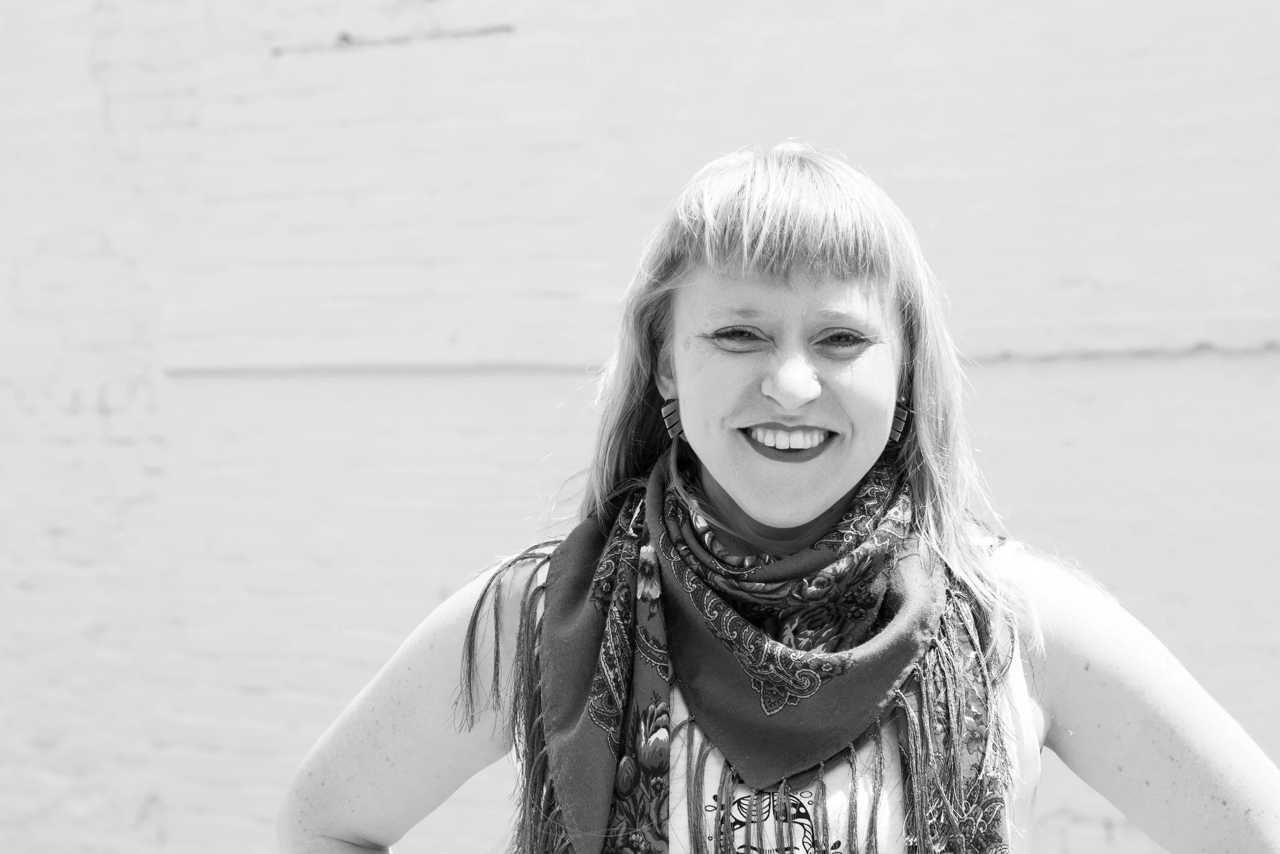 Magdalena Santos, founder of Magdalena Method, smiling outdoors.