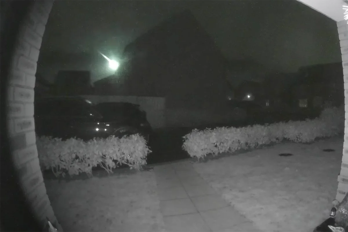 Doorbell security camera night vision footage of a front porch