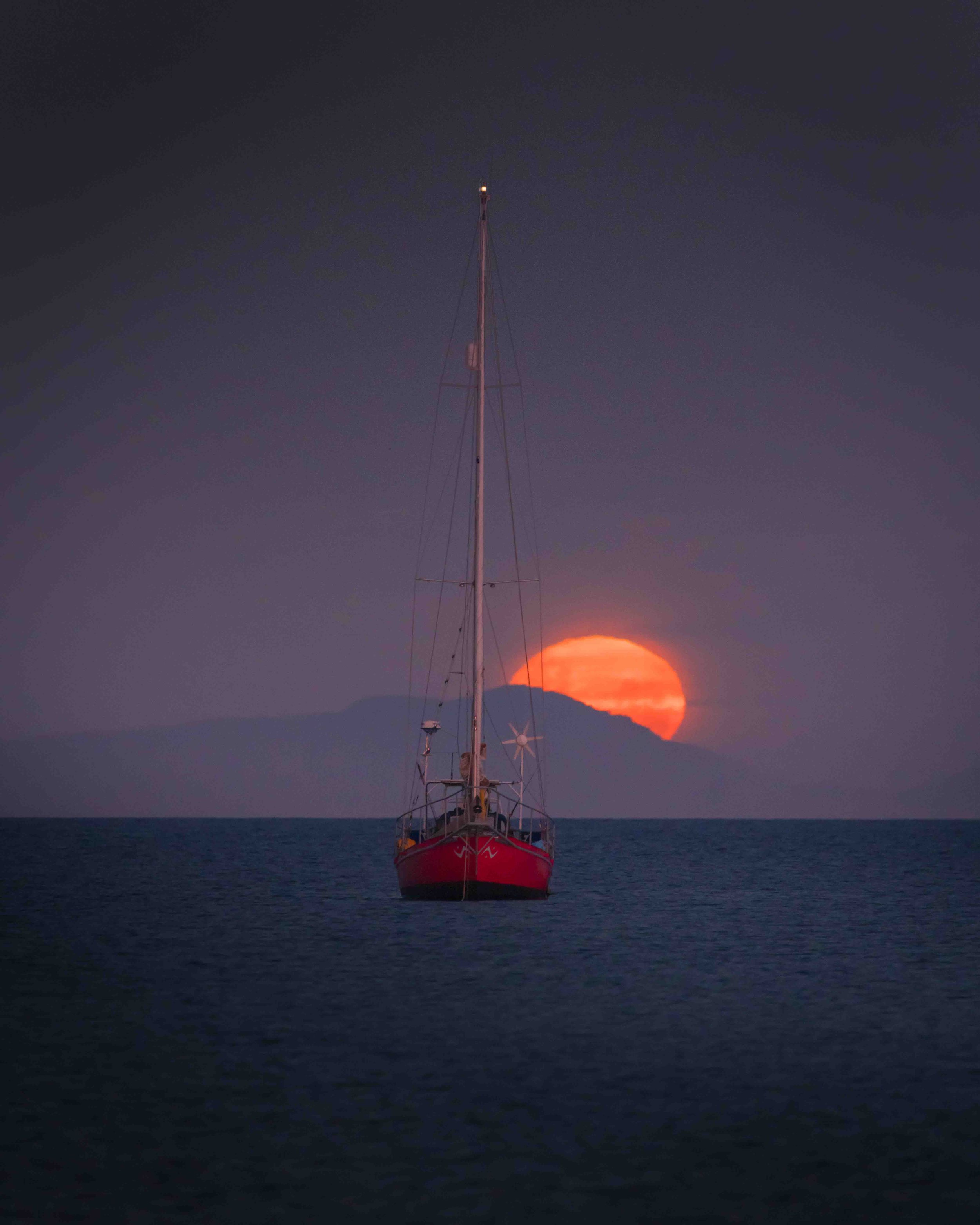 dwayne-lohmann-totaranui-rising-moon-yacht-abel-tasman-blood-moon-fine-art-print.jpg