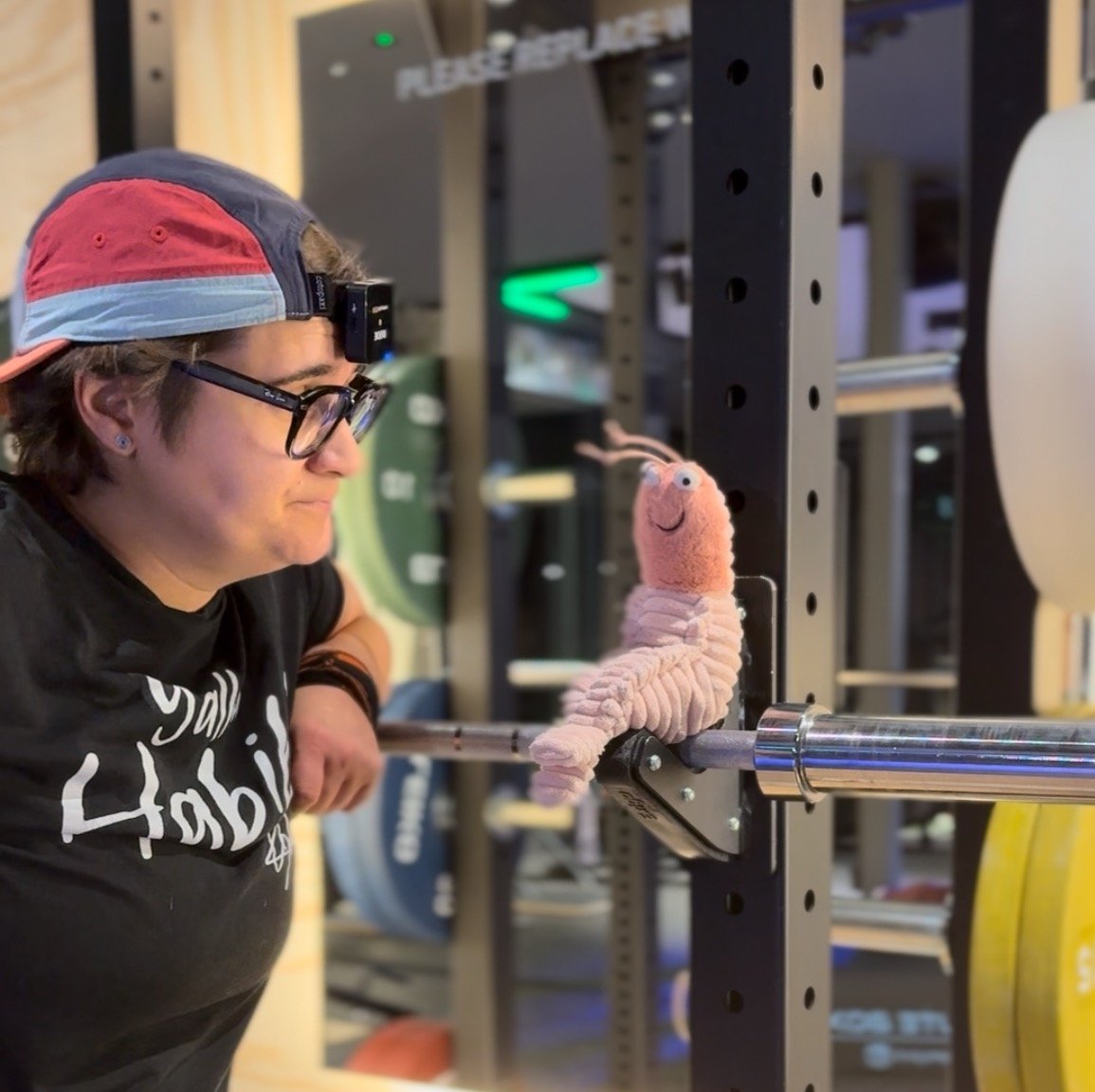 Yasmin and Mr Prawn having a moment during a weightlifting session.