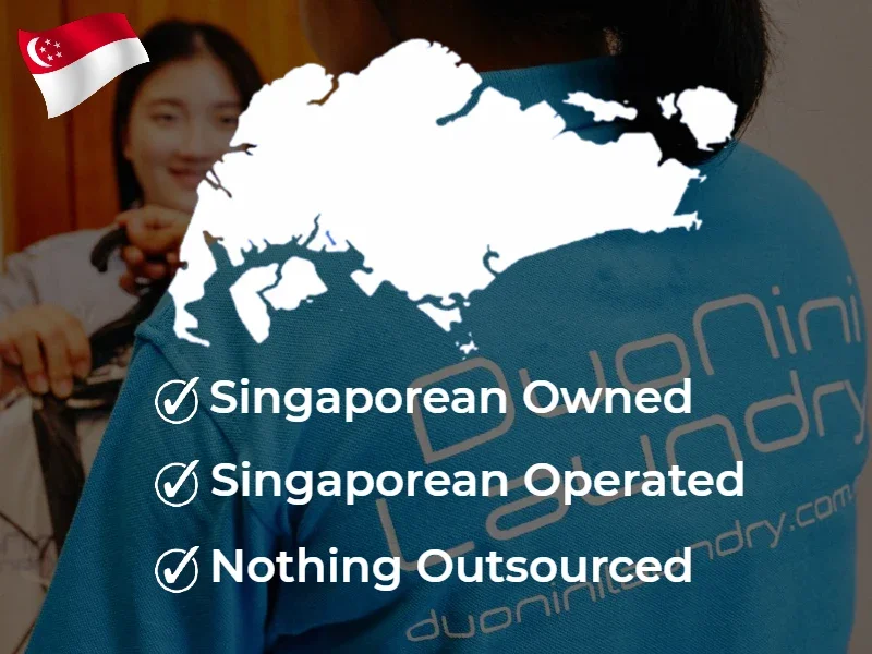 A person wearing a blue uniform with the words "Dunn Laundry" on the back. In the background, there is a woman smiling and holding a laundry bag, with a Singapore flag icon in the top left corner.
