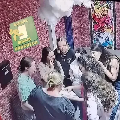 A group of seven people solving puzzles at Escape Rooms Drogheda