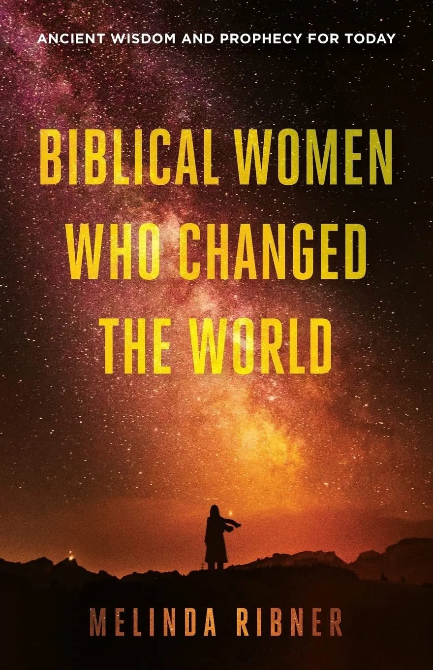 Book cover titled 'Biblical Women Who Changed the World' by Melinda Ribner, featuring a silhouette of a woman standing on rocky terrain under a starry night sky with a prominent galaxy and bright stars.