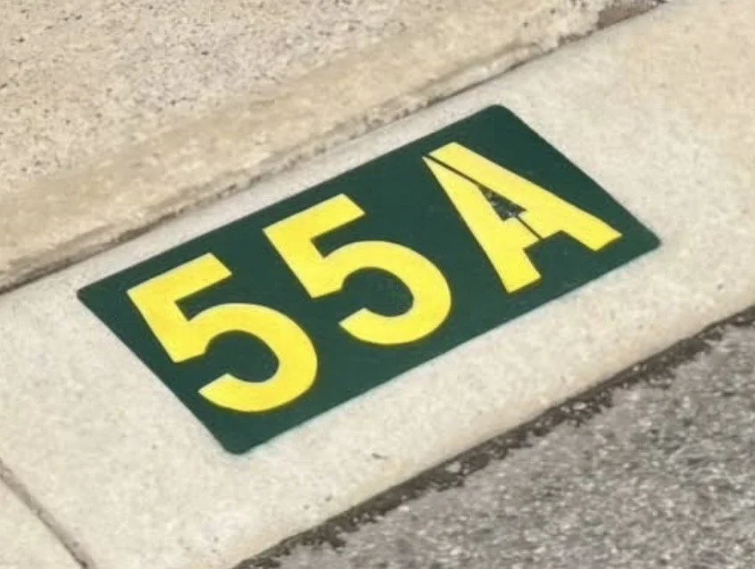 Painted curb numbering