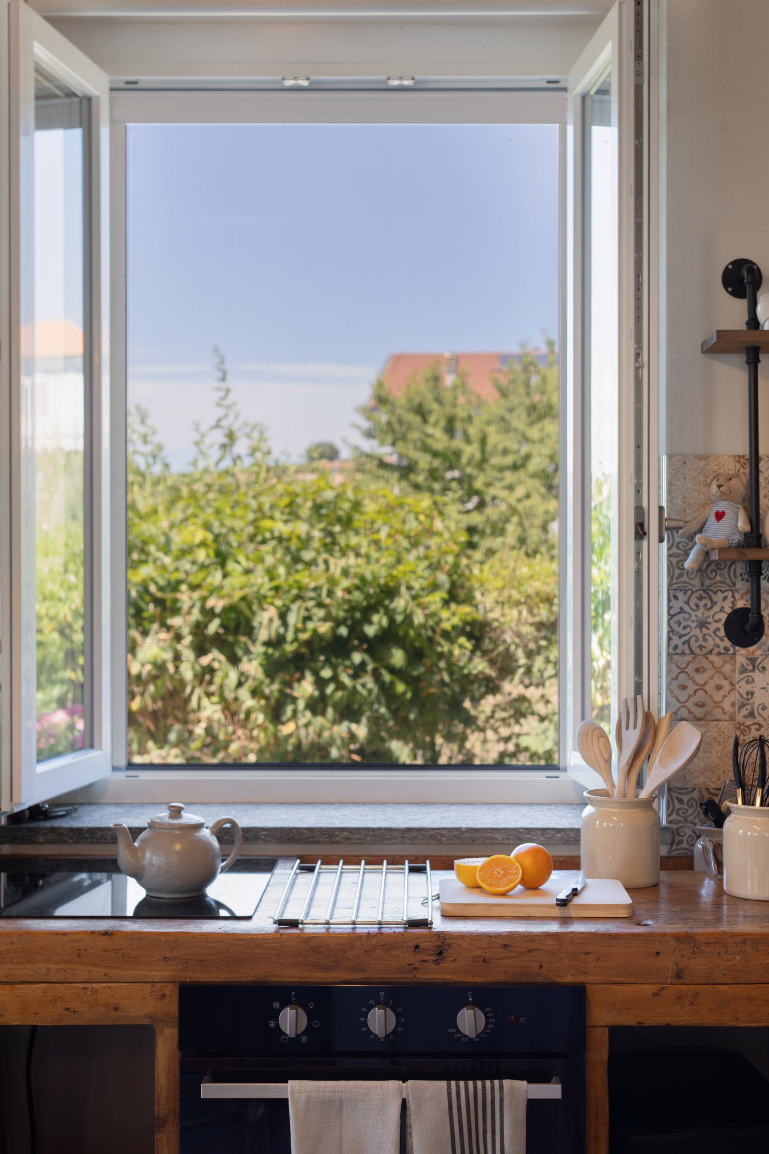 Every window captures nature, the view from the kitchen worktop is an authentic workbench from a "falegnameria" - his or her carpenters bench.