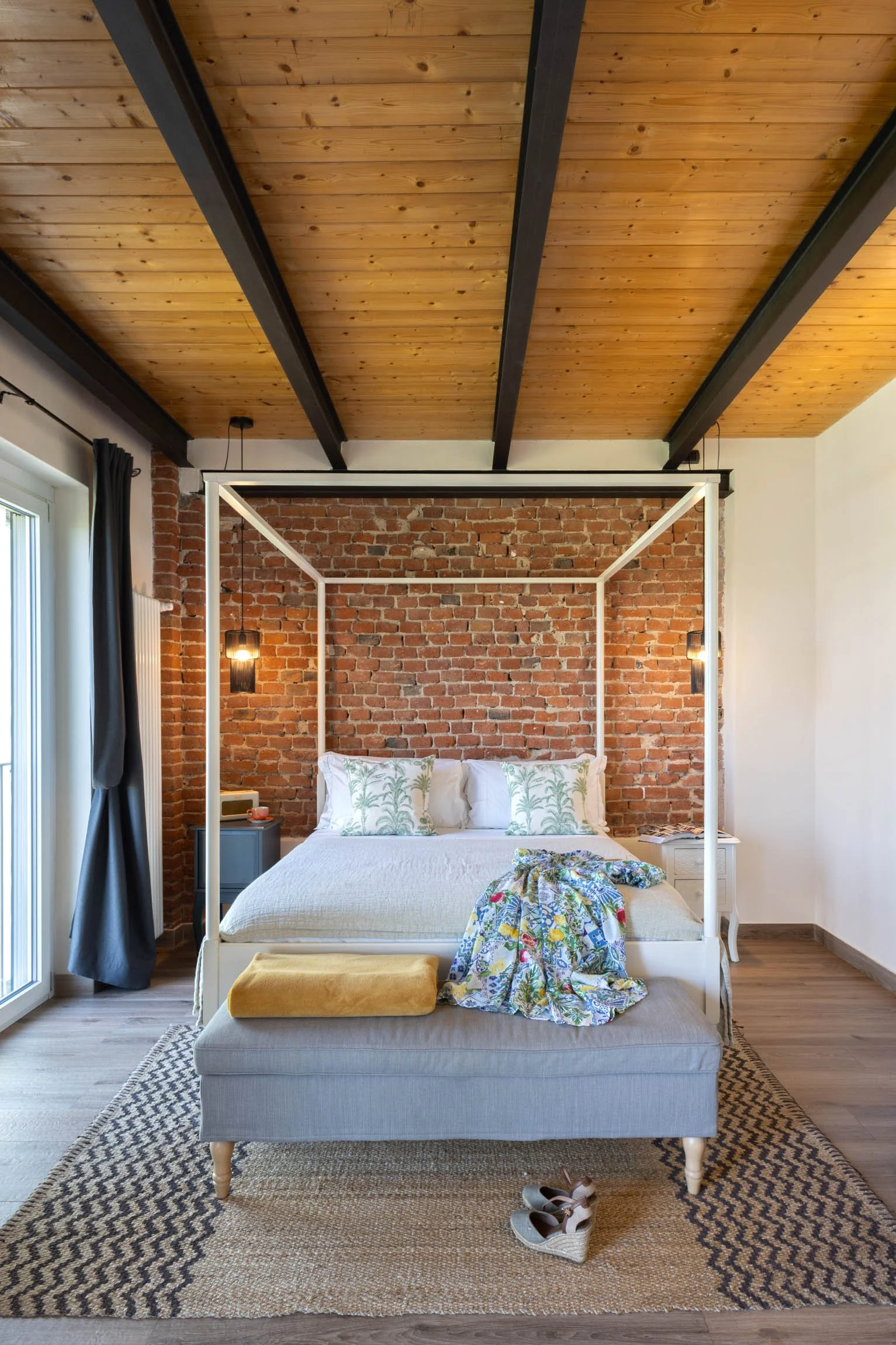 The main en suite bedroom, spacious and airy has used authentic materials to maintain the barn's aesthetic.