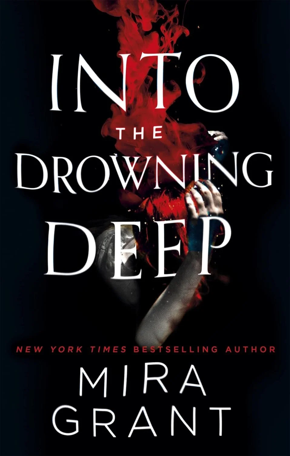 Book cover titled 'Into the Drowning Deep' by Mira Grant, featuring a dark background with red and black ink swirling and a hand holding a snorkel mask.