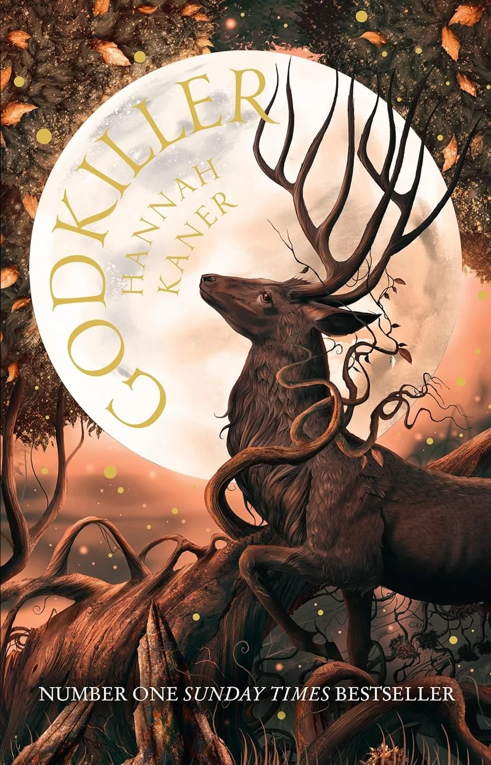 Book cover for 'Godkiller' by Hannah Kaner, featuring an illustration of a deer with antlers that resemble tree branches, set in a forest with a large moon in the background.