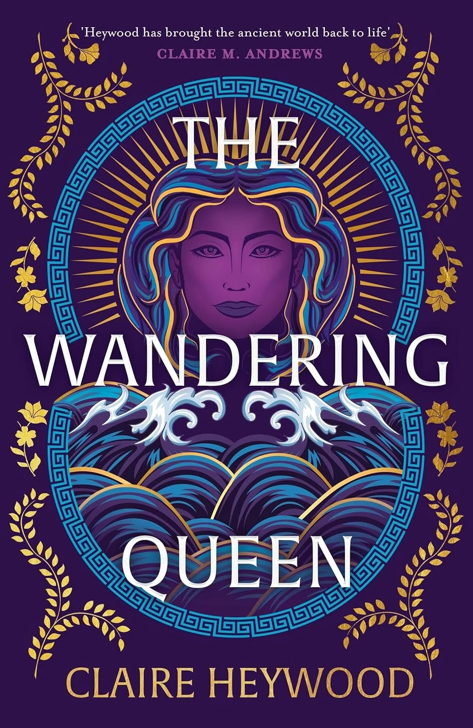 Book cover titled 'The Wandering Queen' by Claire Heywood, featuring an illustration of a woman with purple skin and flowing blue and gold hair, surrounded by blue waves and golden decorative leaves on a dark purple background.