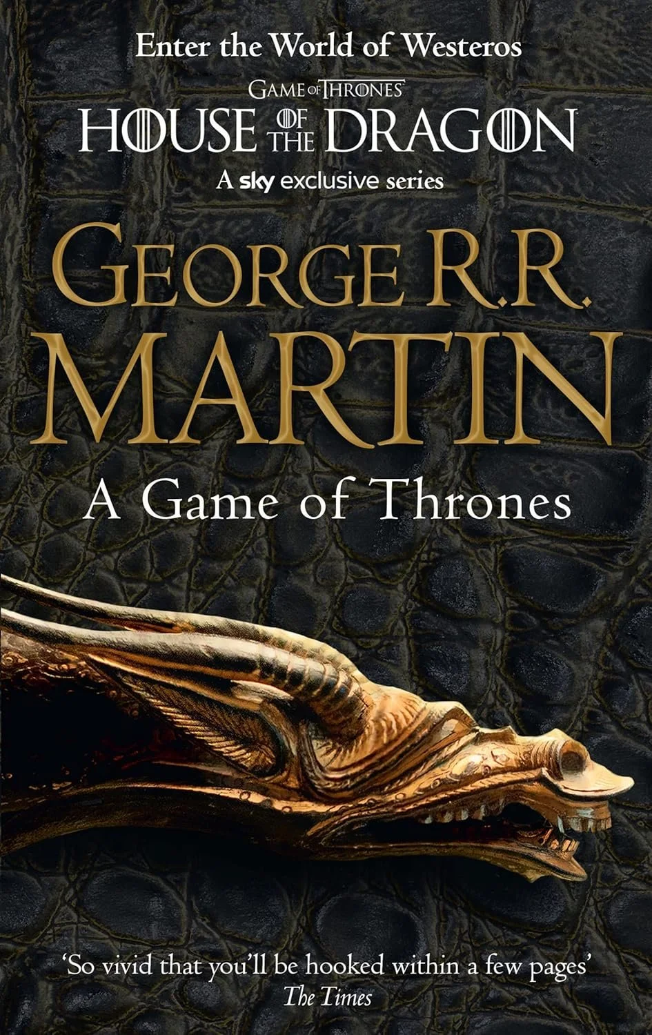 Book cover of 'Fire & Blood' by George R.R. Martin, featuring a dragon head sculpture against a dark, textured background with the title and author name in large font.