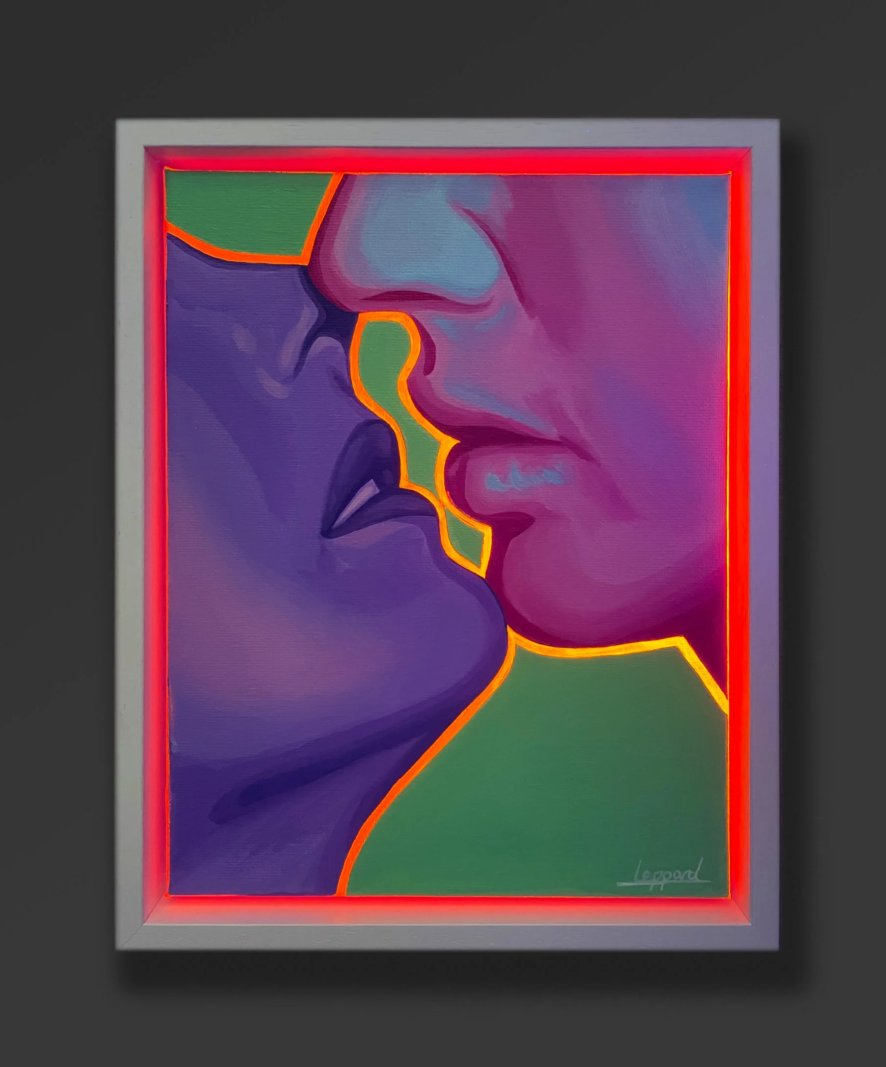 Abstract artwork of a human face with bold outline, painted in vibrant colors, framed with a white border and neon red lighting.