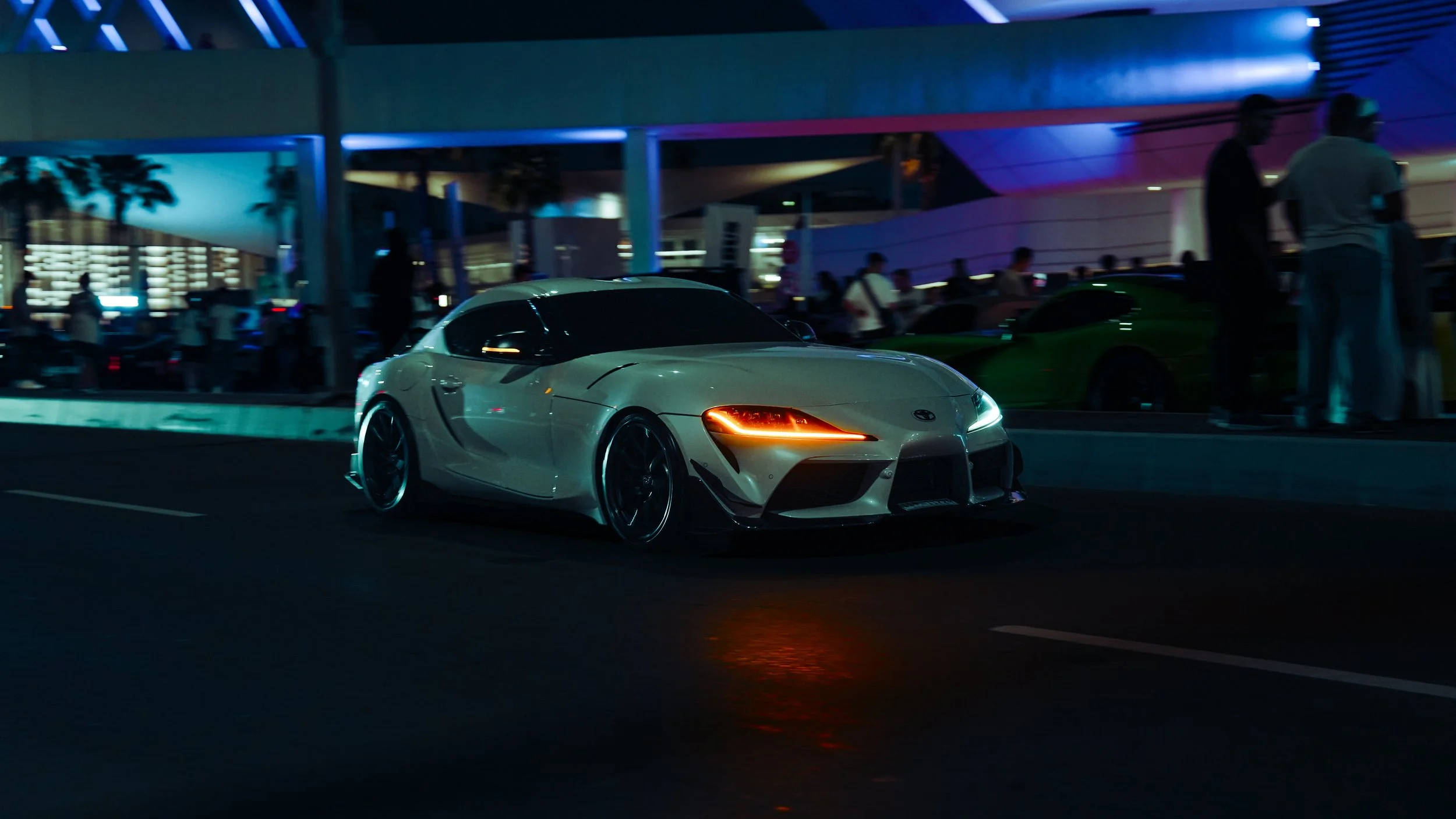 A Supra gliding through the night.