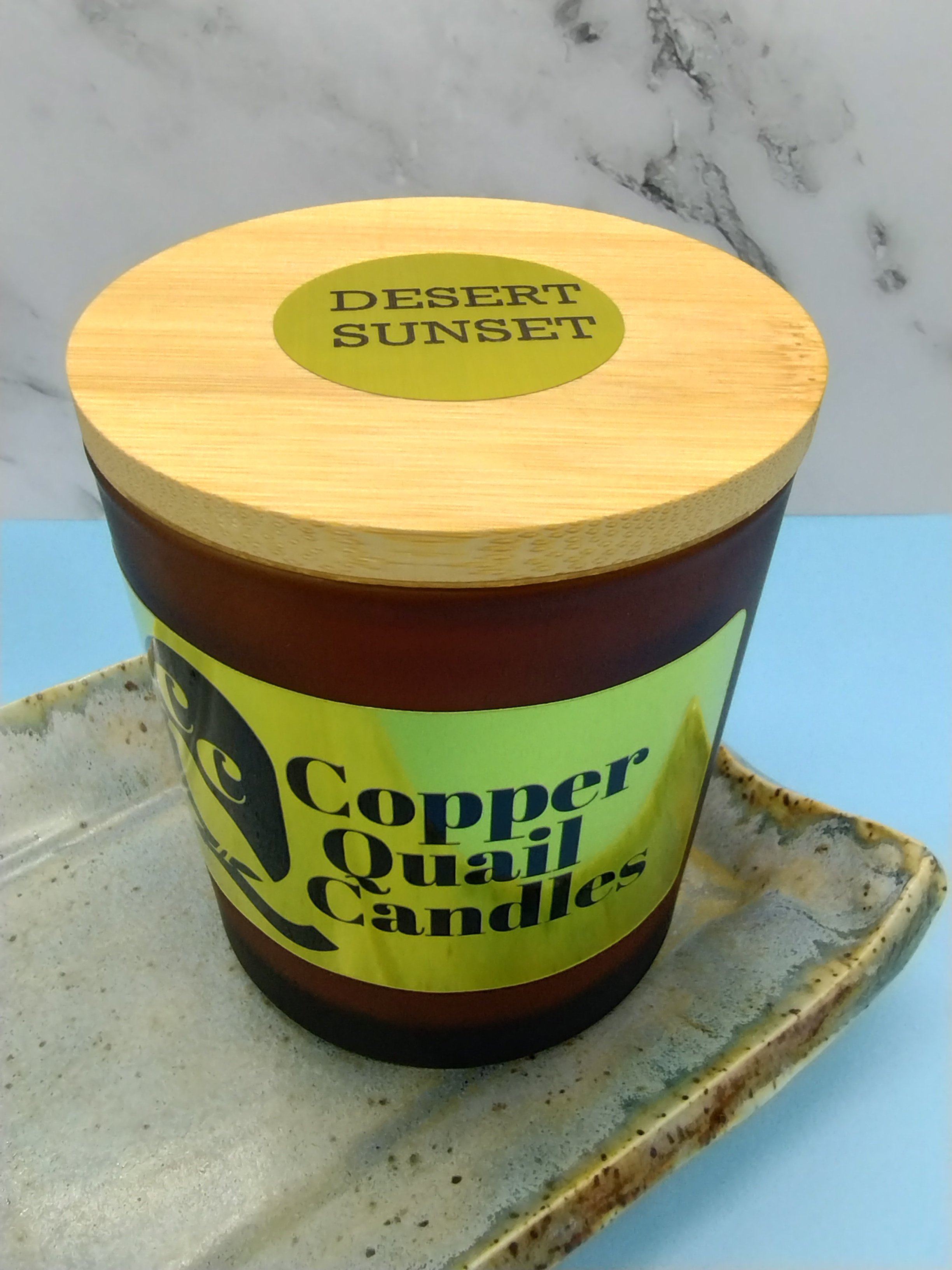candle in frosted jar with wooden lid