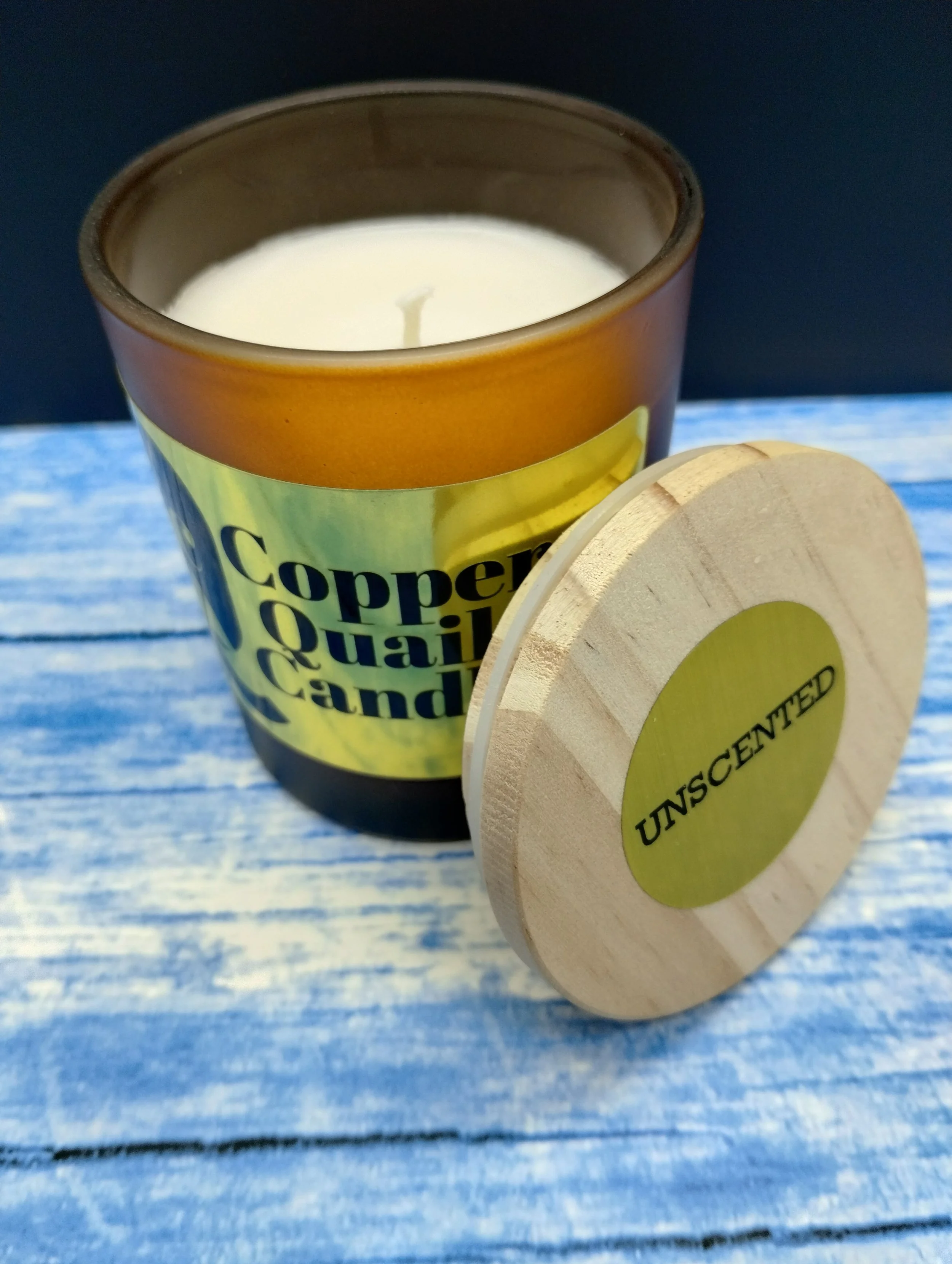 candle in a frosted brown jar