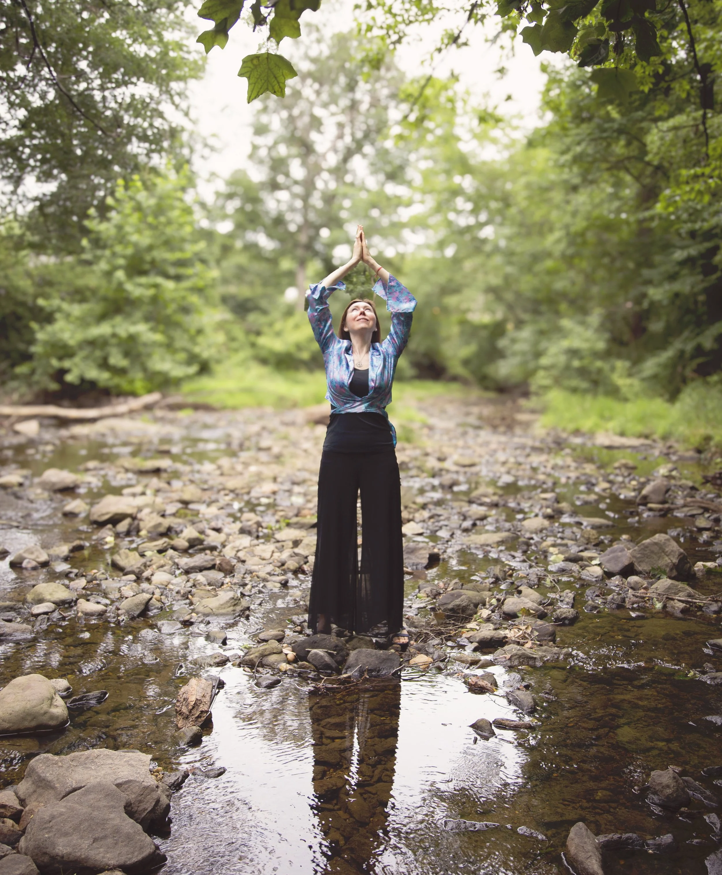 Dr. Lienna Wilson, PsyD, practicing mindful breathing outdoors to support nervous system regulation