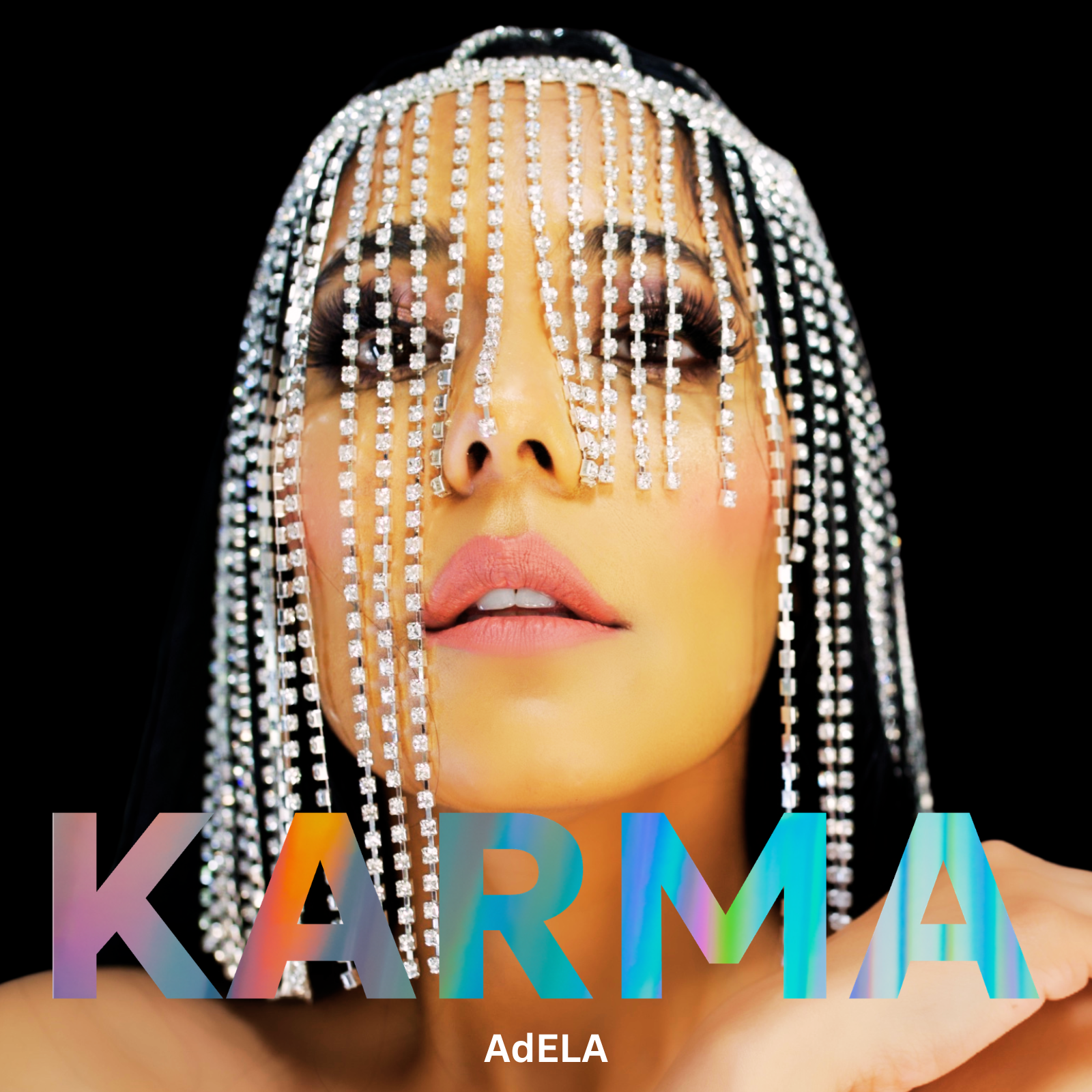 Close-up of a woman with patterned makeup, wearing long earrings with hanging diamonds, with the word 'KARMA' in colorful, holographic text at the bottom.