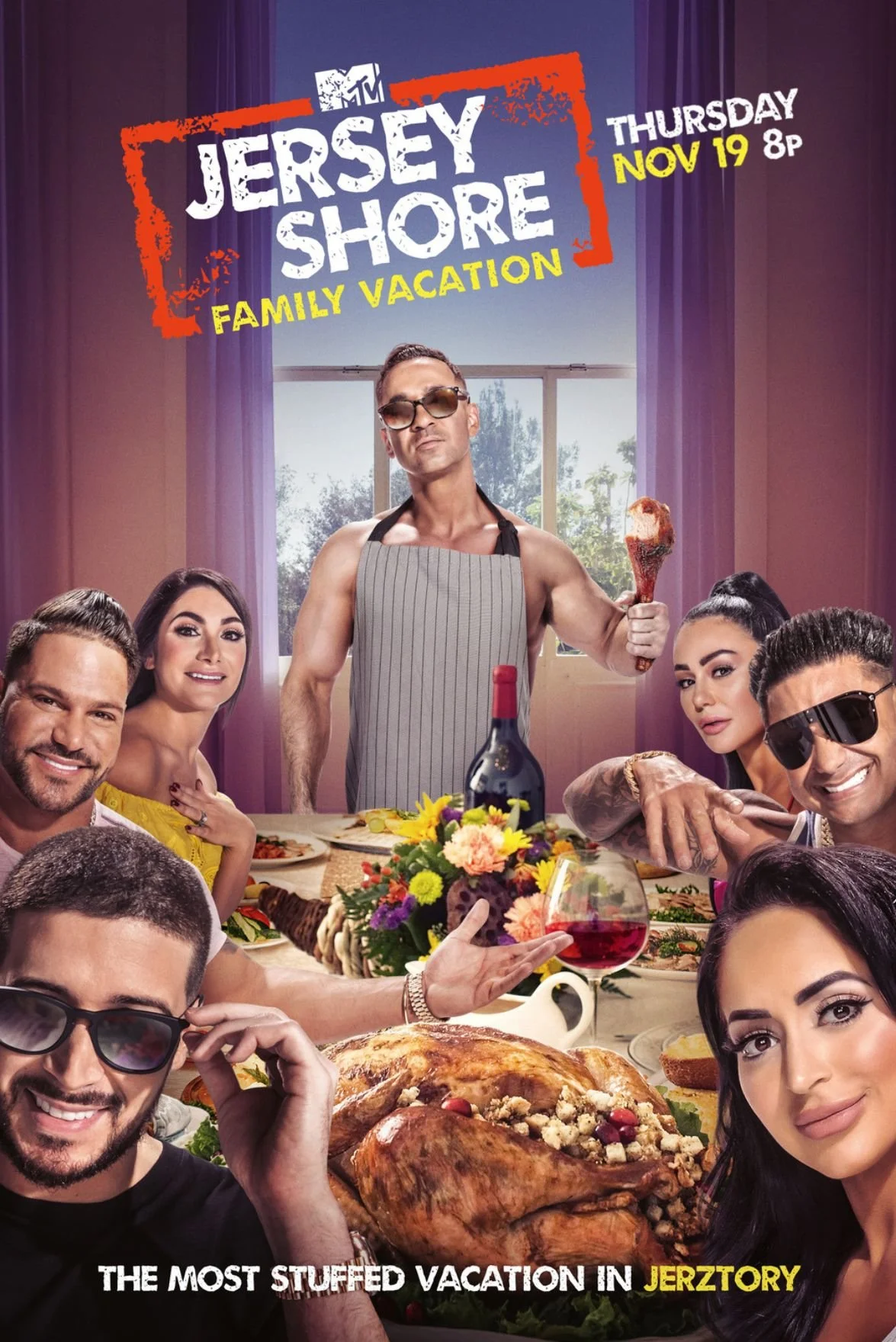 Group of people sitting around a festive dinner table with turkey, wine, and flowers, with a man wearing sunglasses and an apron standing behind holding a drumstick in a decorated room with purple curtains and a window, promoting Jersey Shore Family Vacation on MTV on November 19th.