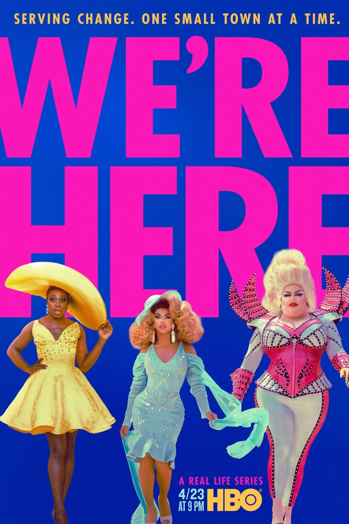 Poster for the TV series 'We're Here' featuring three drag performers in colorful costumes, with the show's tagline 'Serving change. One small town at a time.' and details indicating it airs on HBO on April 23 at 9 PM.