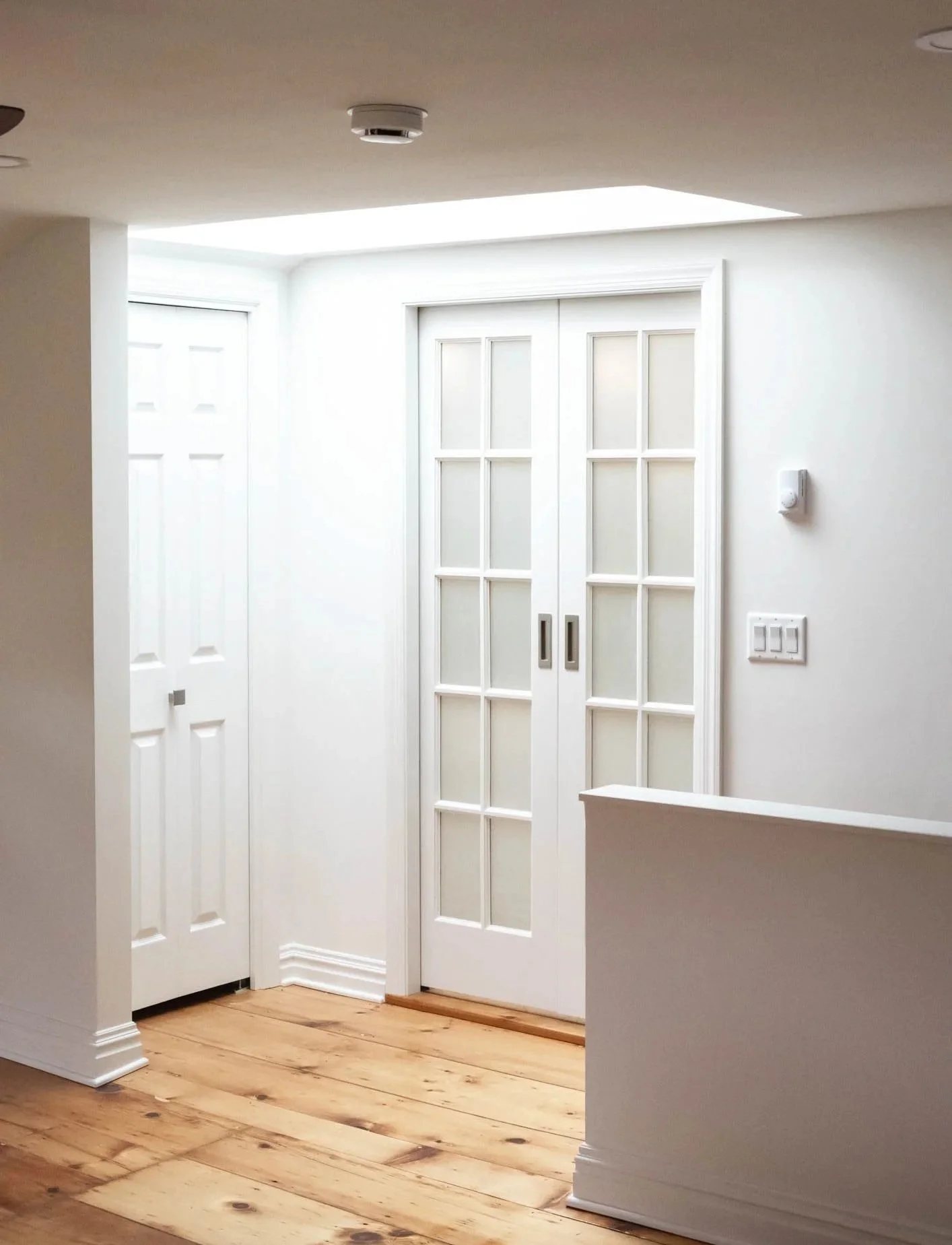 farmhouse loft, frosted glass pocket door, skylight, hardwood floors