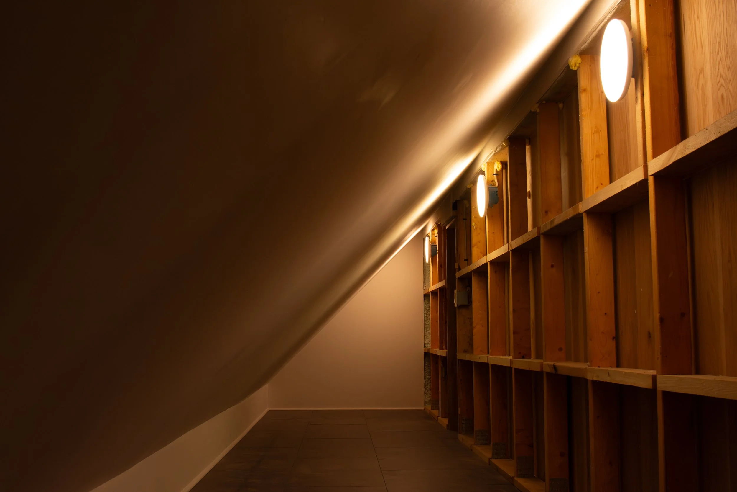exposed framing in loft storage with circular LEDs