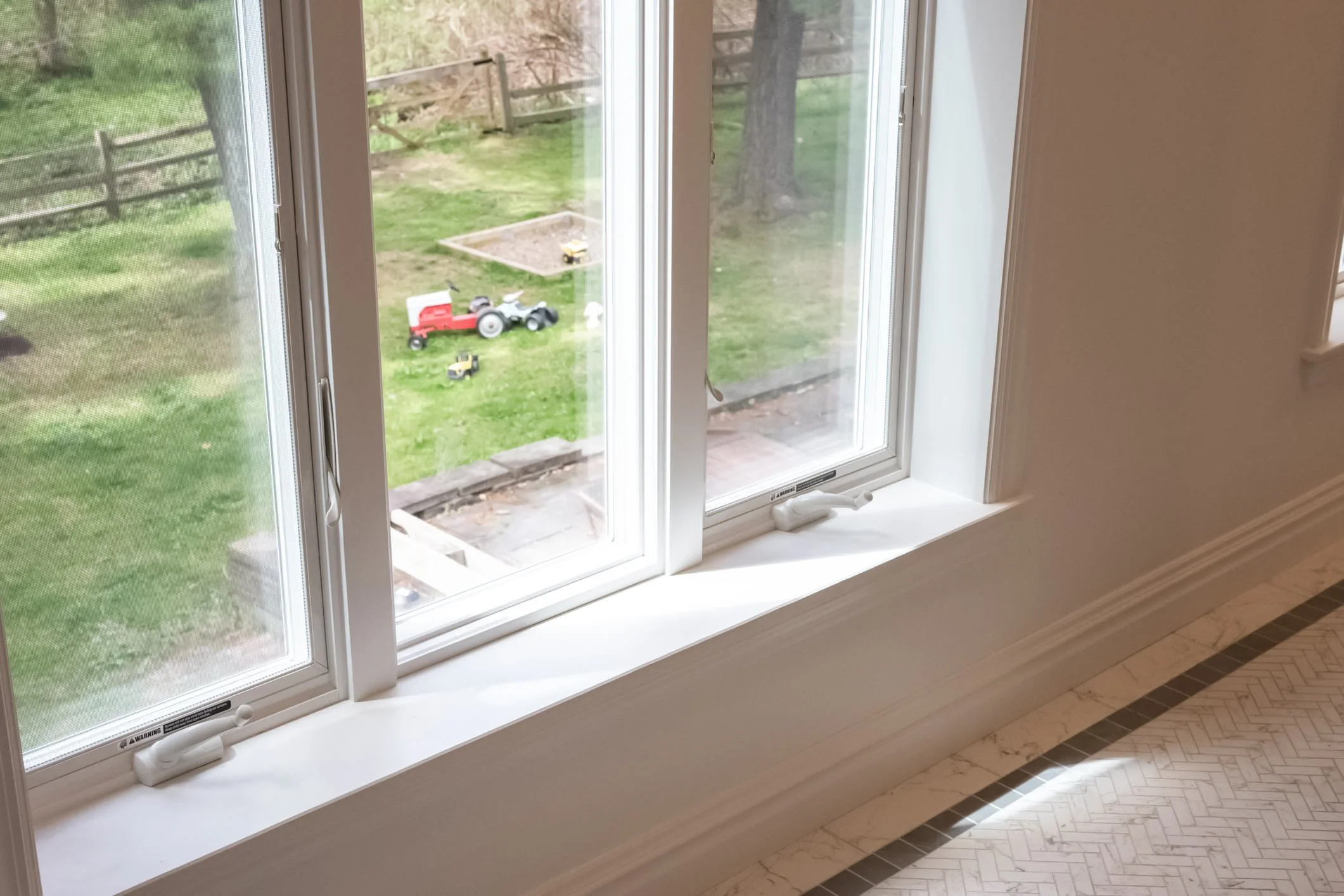 updated farmhouse bathroom Anderson windows