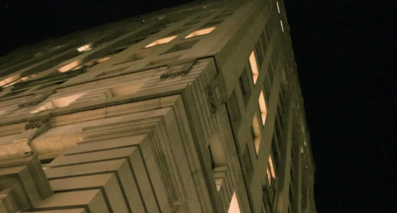 Tall building at night with lit windows