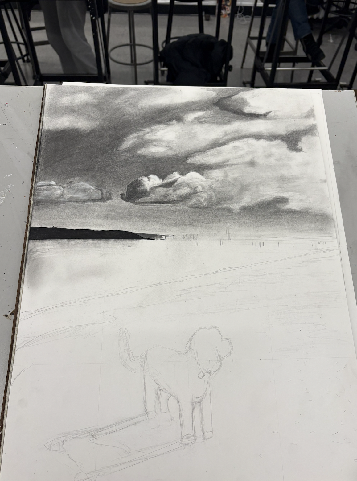 A drawing in progress of a landscape scene with cloudy sky, distant land, and a body of water, with a partially sketched dog in the foreground.