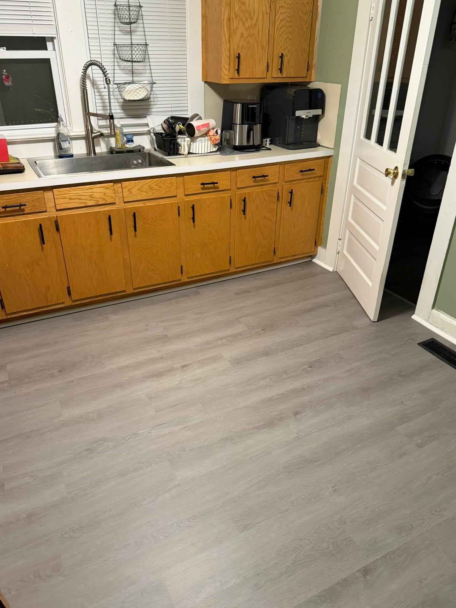 A complete transformation from the ground up! We refreshed this room with durable, premium flooring that completely elevates the space—and having another incredibly happy homeowner makes it even better.