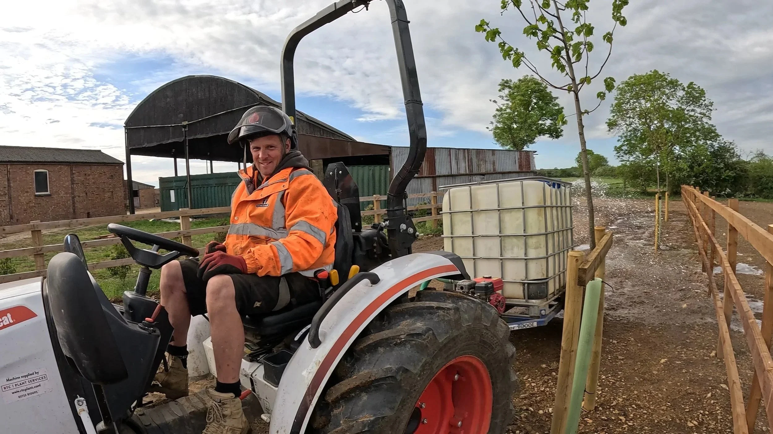 HTC Arbor Services Grounds services operative working on a 3 Ton Tractor with Water Bowser