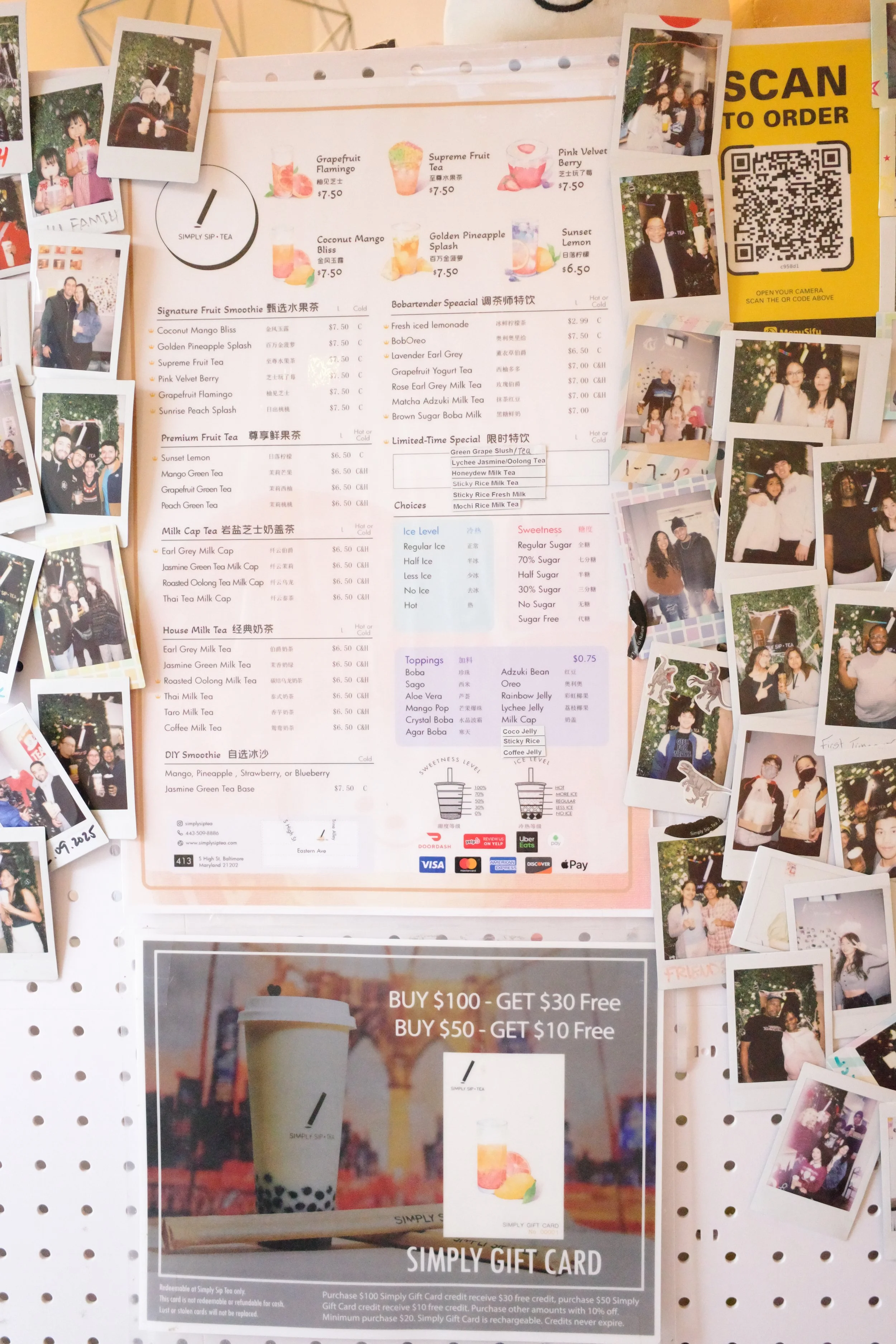 A menu for a tea shop surrounded by small printed photos of people, with promotional offers on a gift card at the bottom.