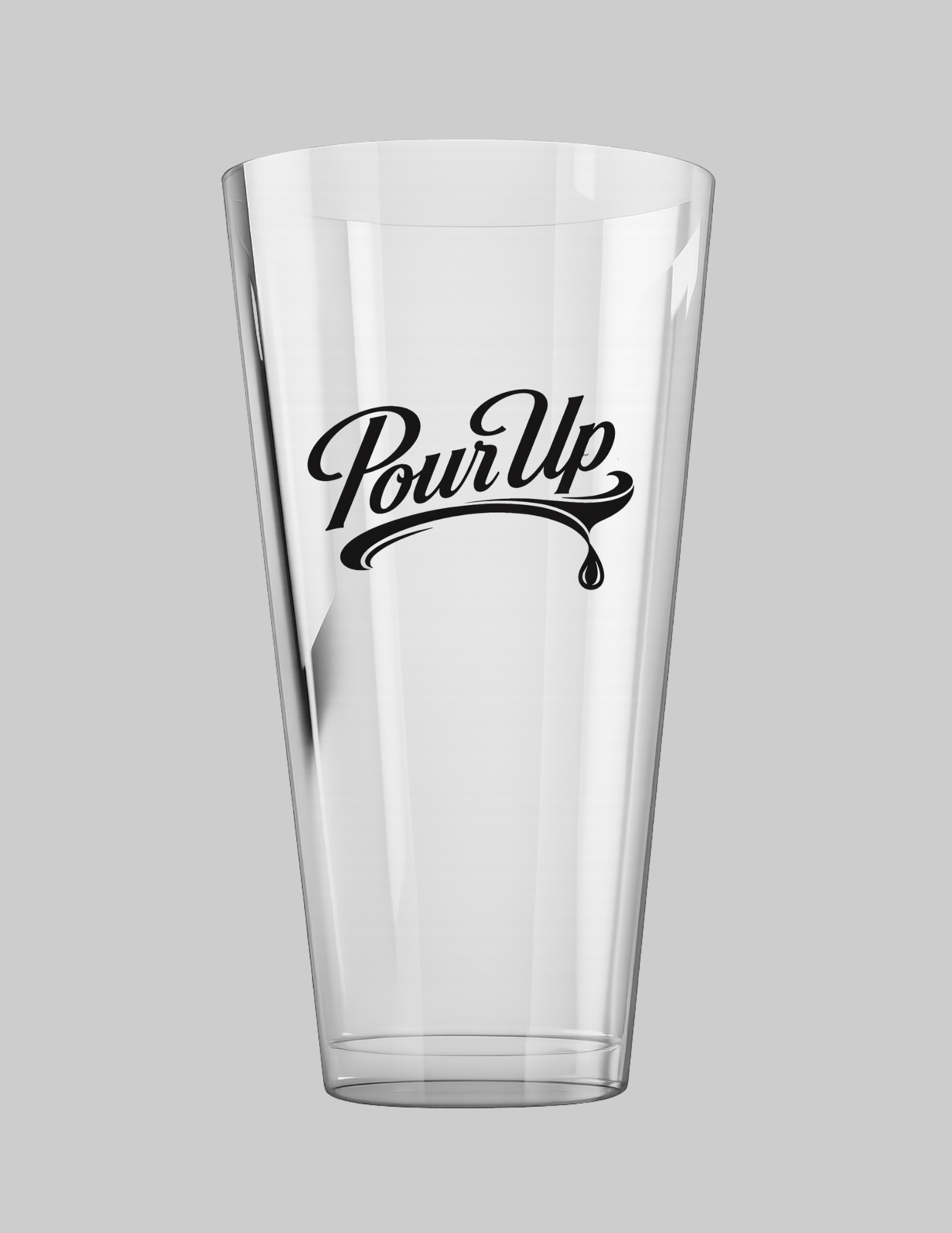 A clear glass with the words "Pour Up" written in black, stylized script, and a small droplet graphic beneath the text, placed against a plain gray background.