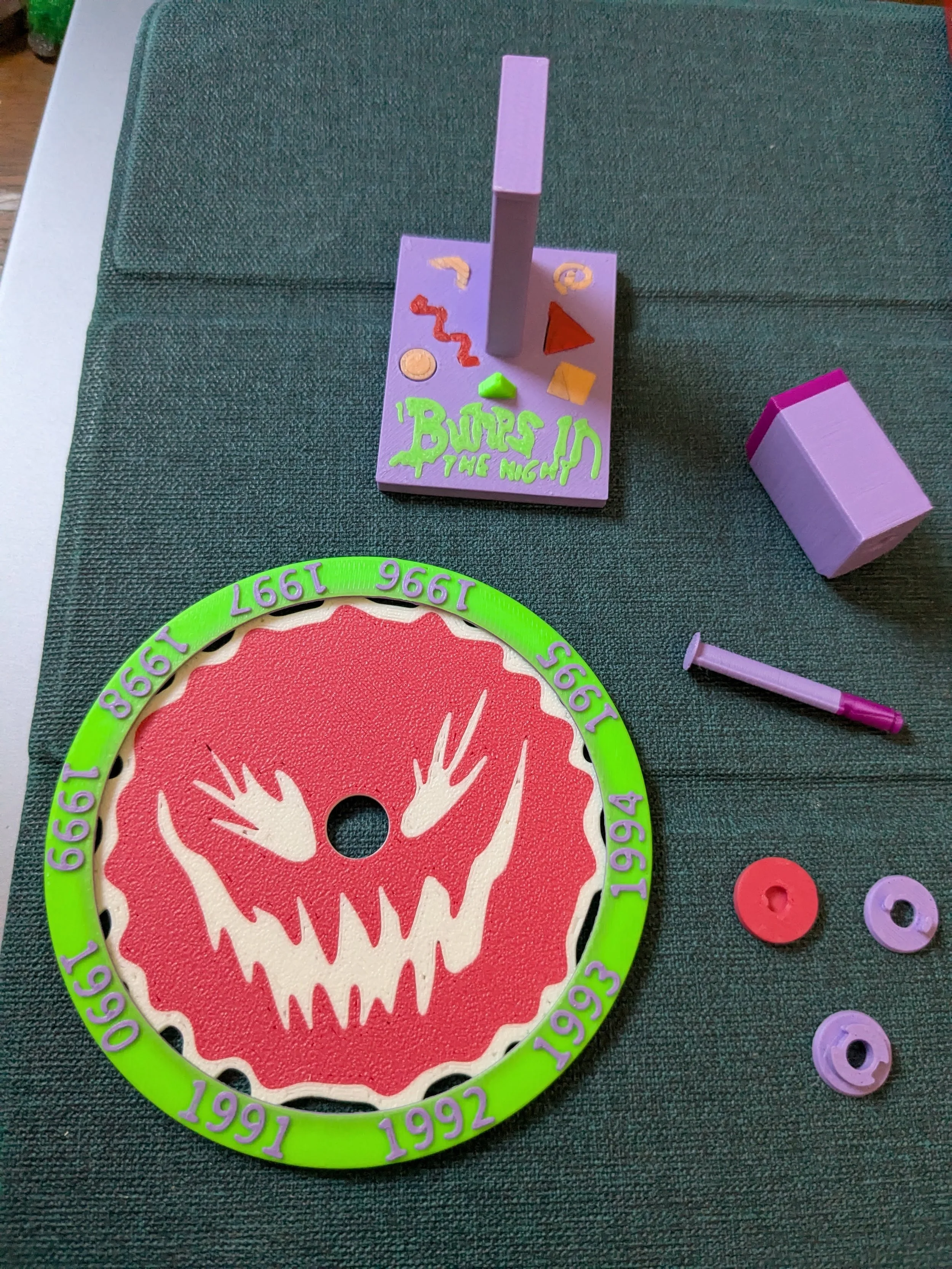 The individual disassembled pieces of the terror portal spinning wheel, before they were superglued.